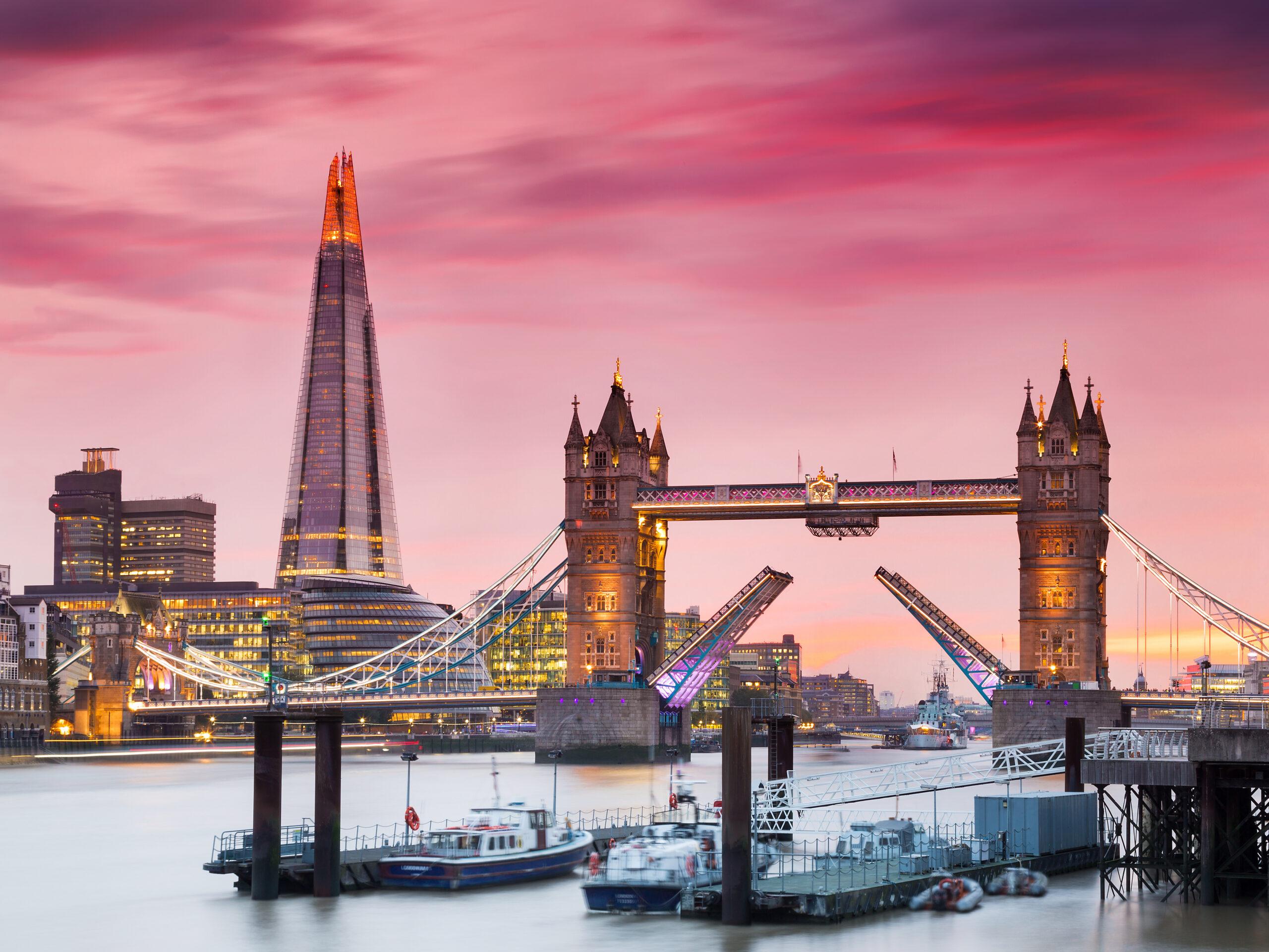 Tower Bridge is a bascule bridge that opens for taller-masted vessels and closes again./Shutterstock