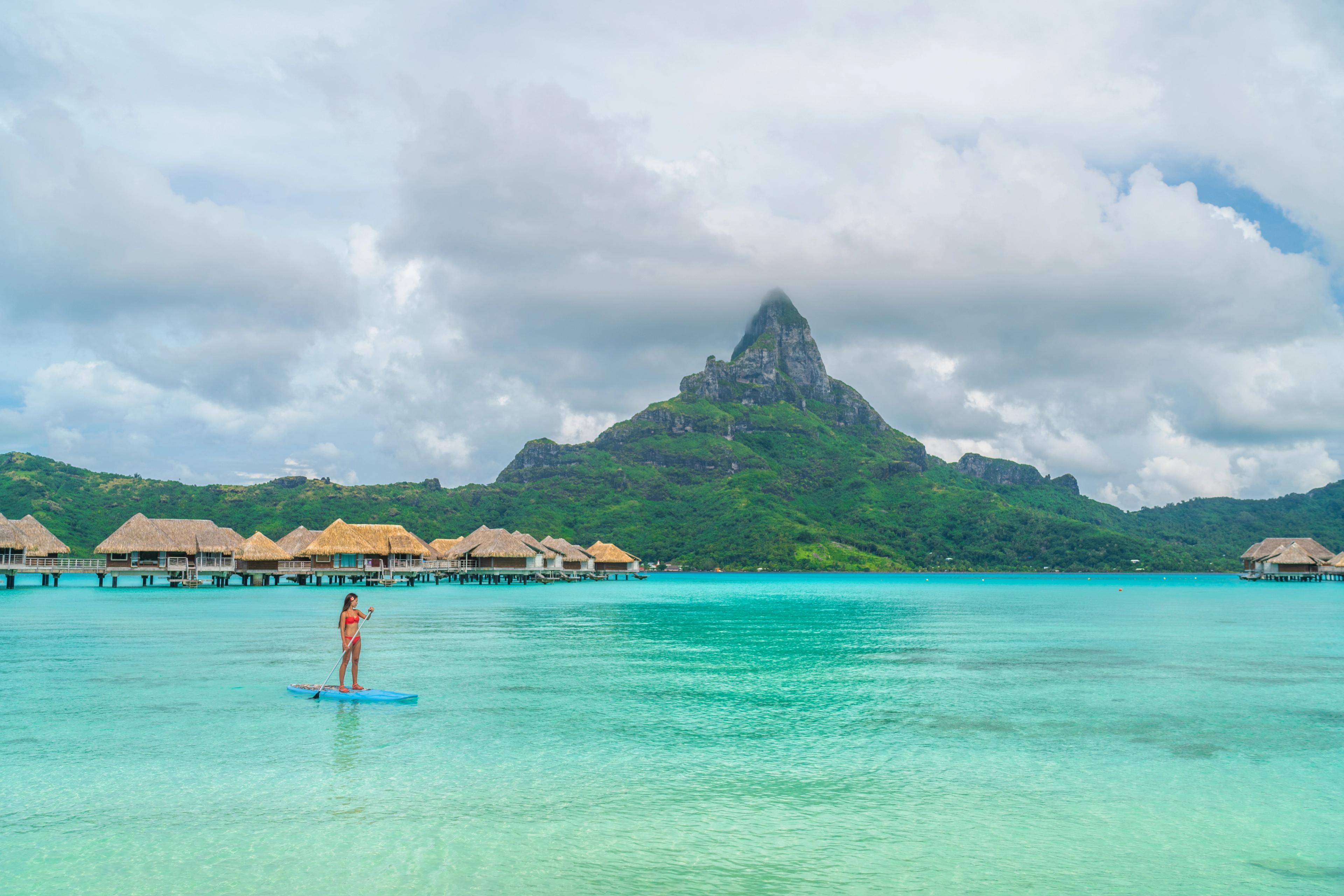 Resort hotel, Bora Bora, shows off scenery warmed by the sun and framed by shades of blue./Shutterstock