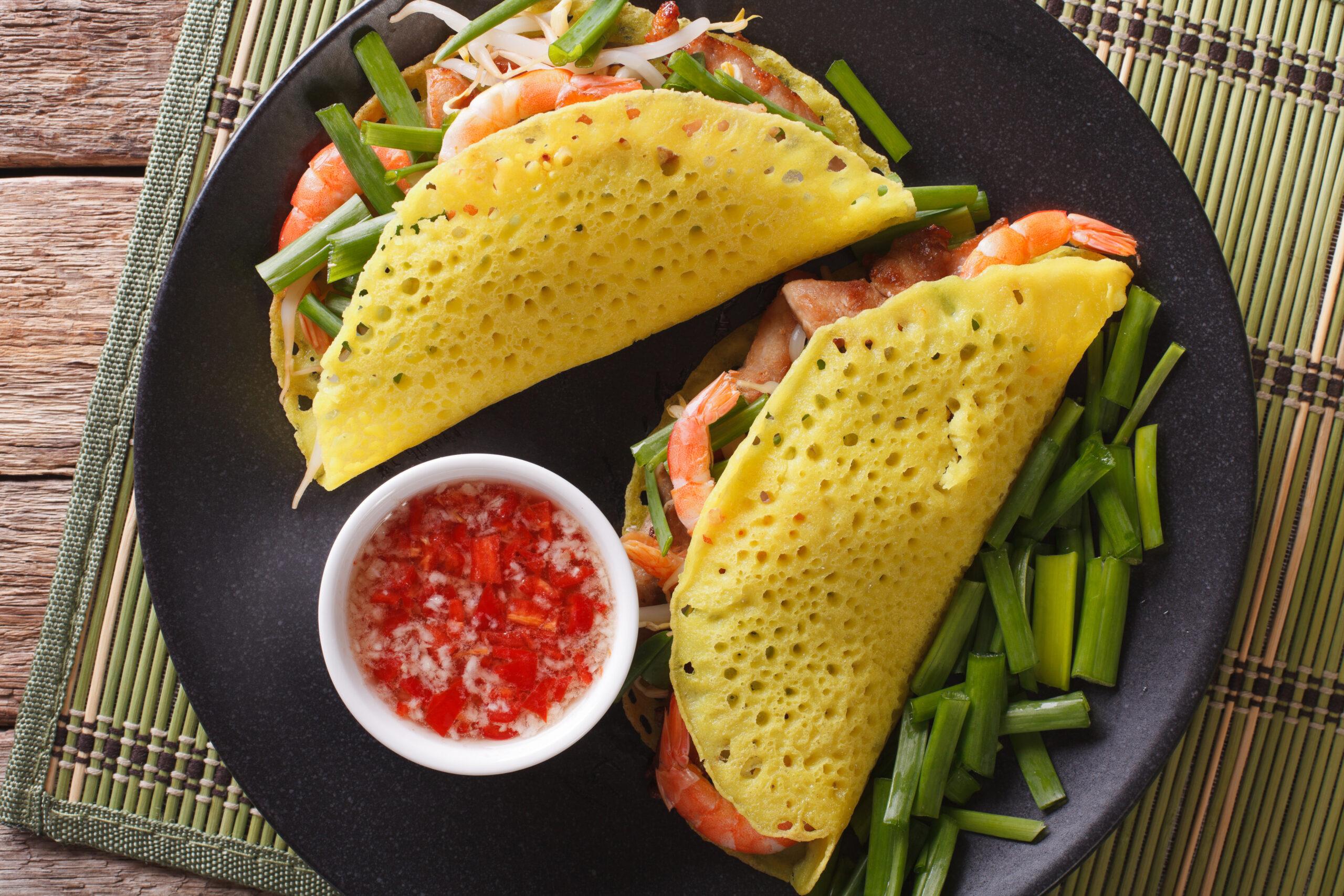 Flavors play off one another in Bahn Xeo, a sweet and savory favorite in Vietnam./Shutterstock