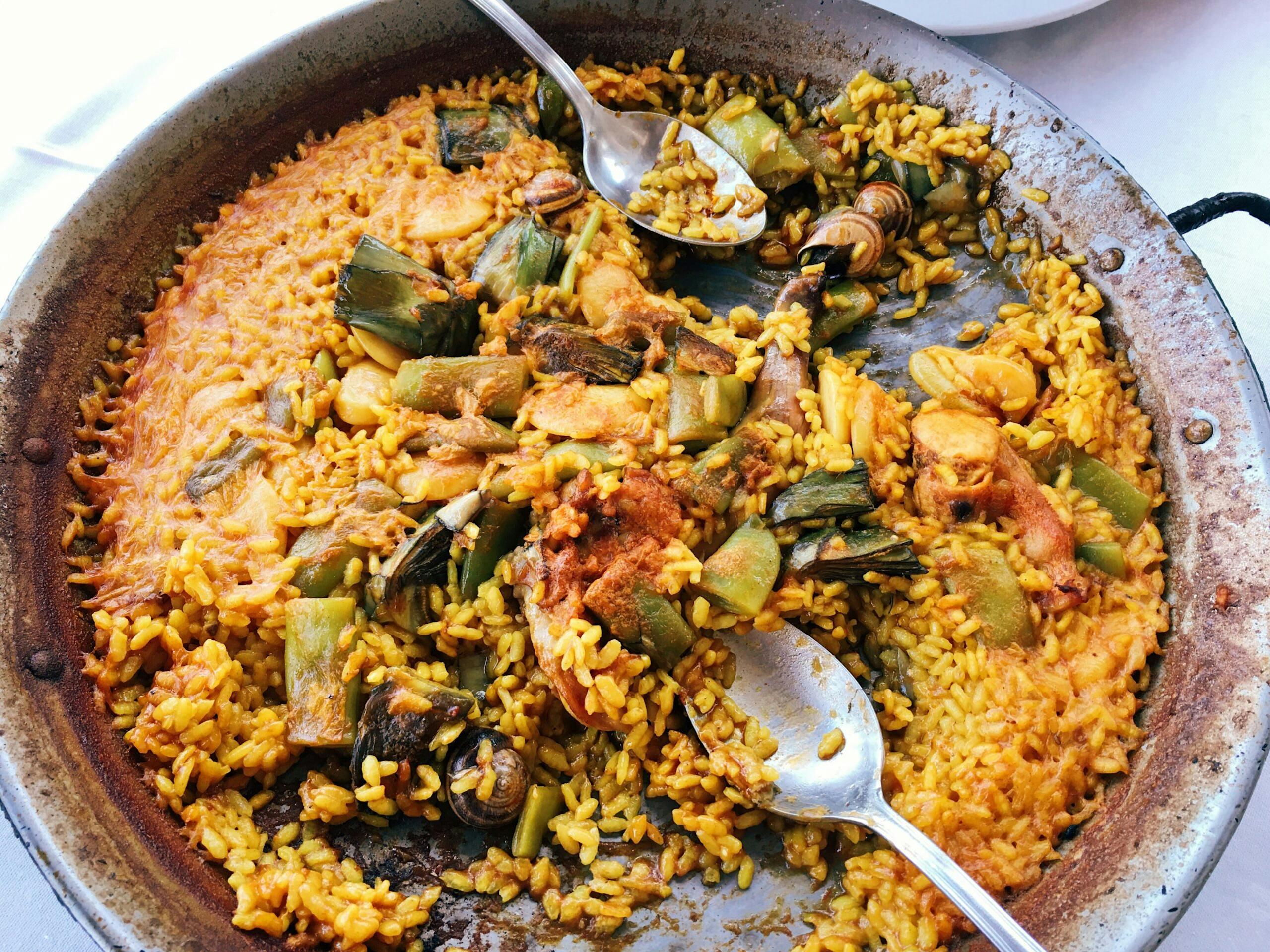 Paella Valenciana contains chicken, rabbit and snails./Getty Images