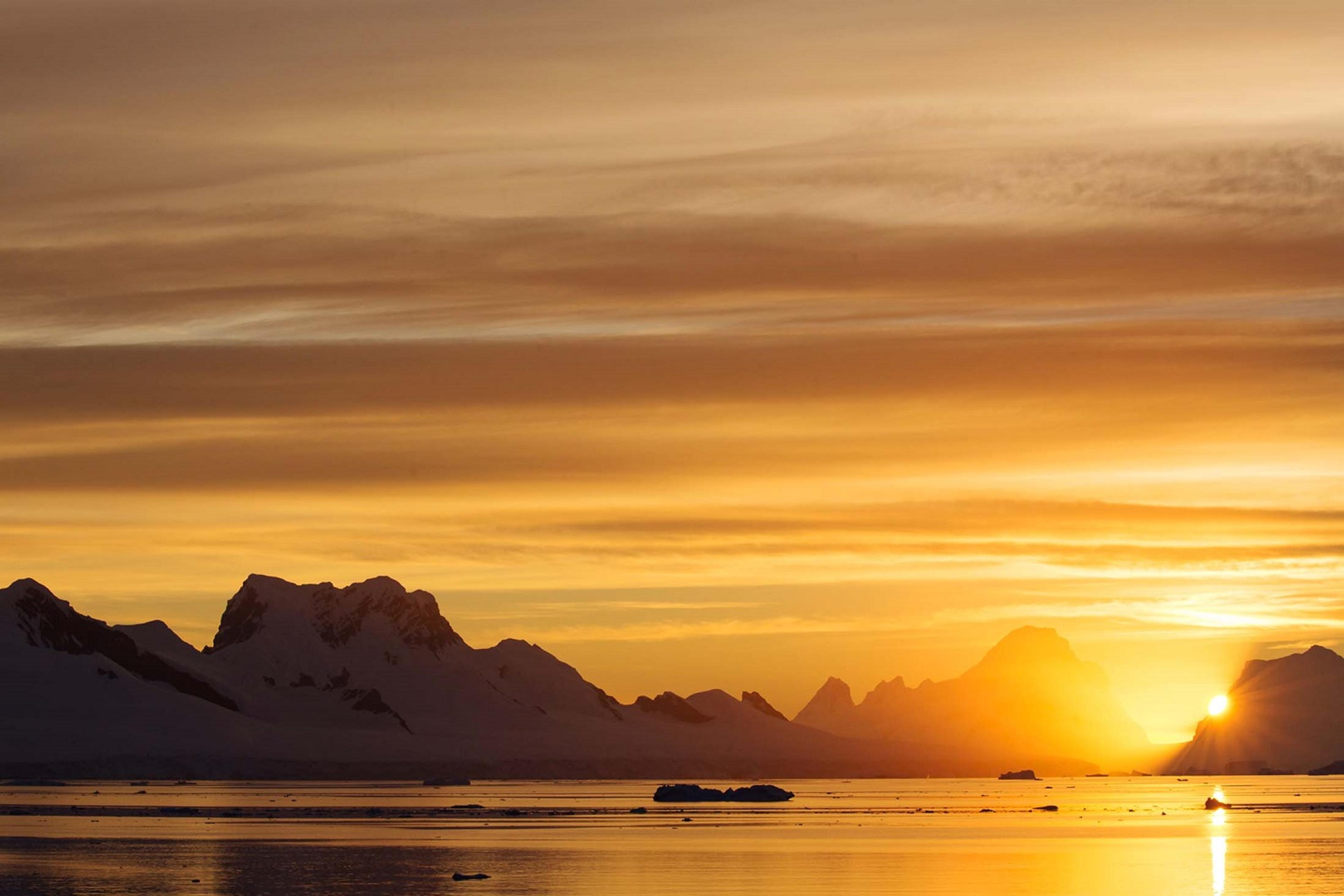 Silversea's guests cruise under a golden sky in the Errera Channel./Denis Elterman