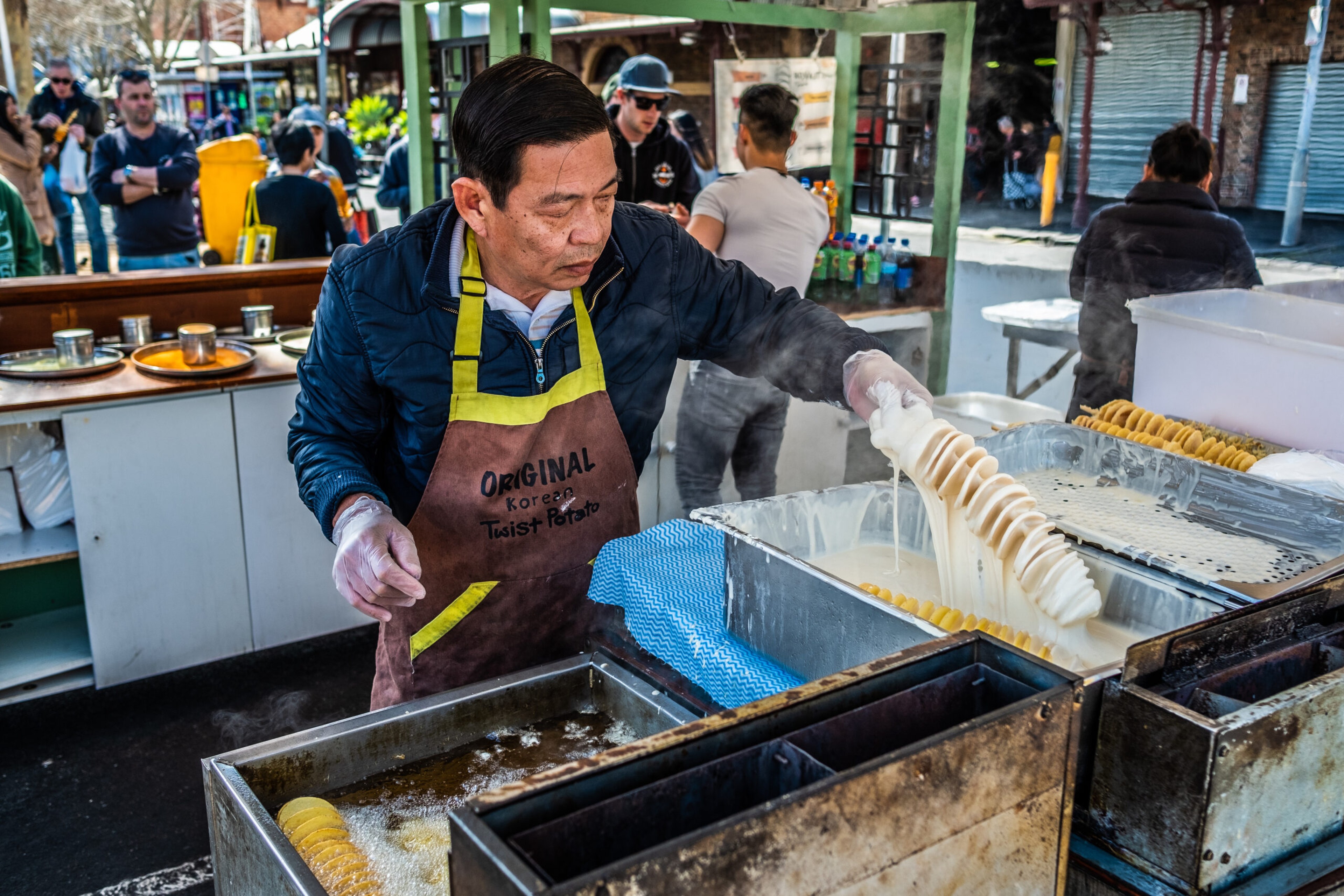 MELBOURNE A man makes sprial fried potato strips at the Queen Victoria Market in Melbourne, Australia