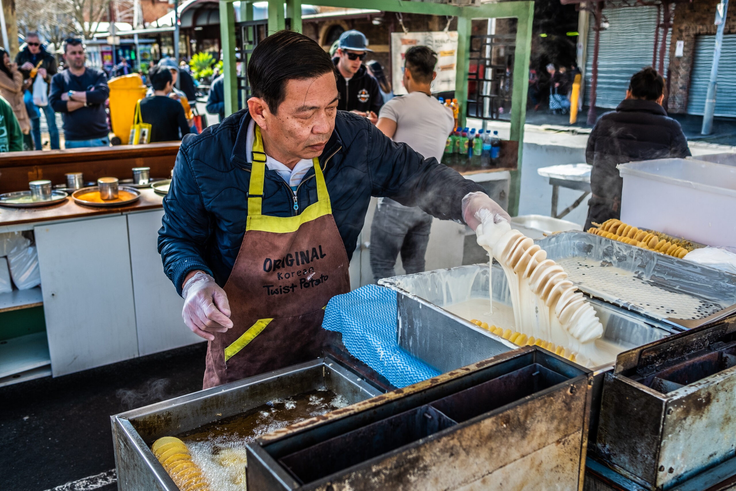 MELBOURNE A man makes sprial fried potato strips at the Queen Victoria Market in Melbourne, Australia