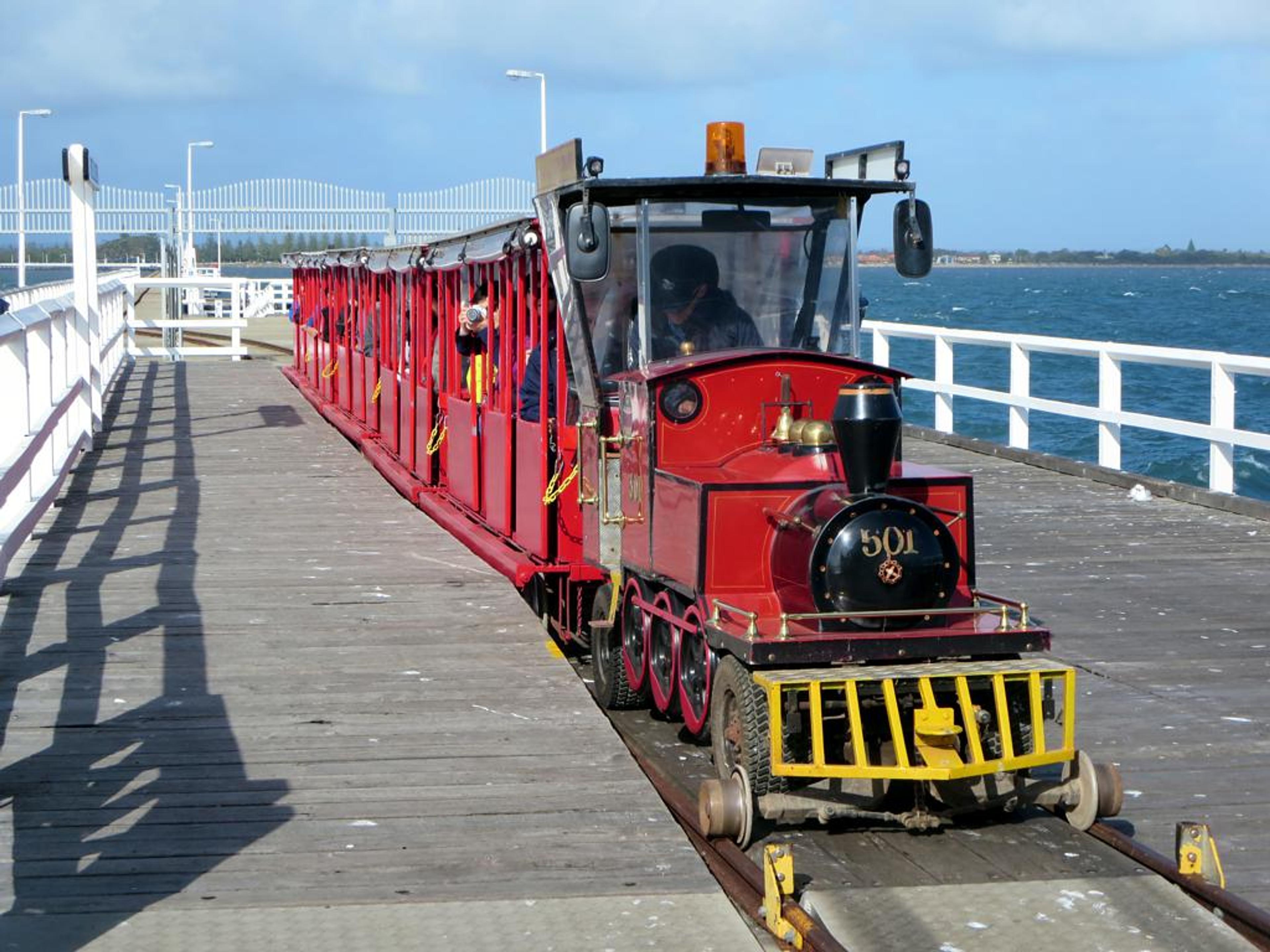A miniature railway runs about 1 1/4 miles on the Busselton Jetty at Busselton, Western Australia, carrying visitors to an Underwater Observatory./Wikimedia Commons/Photo by David Stanley