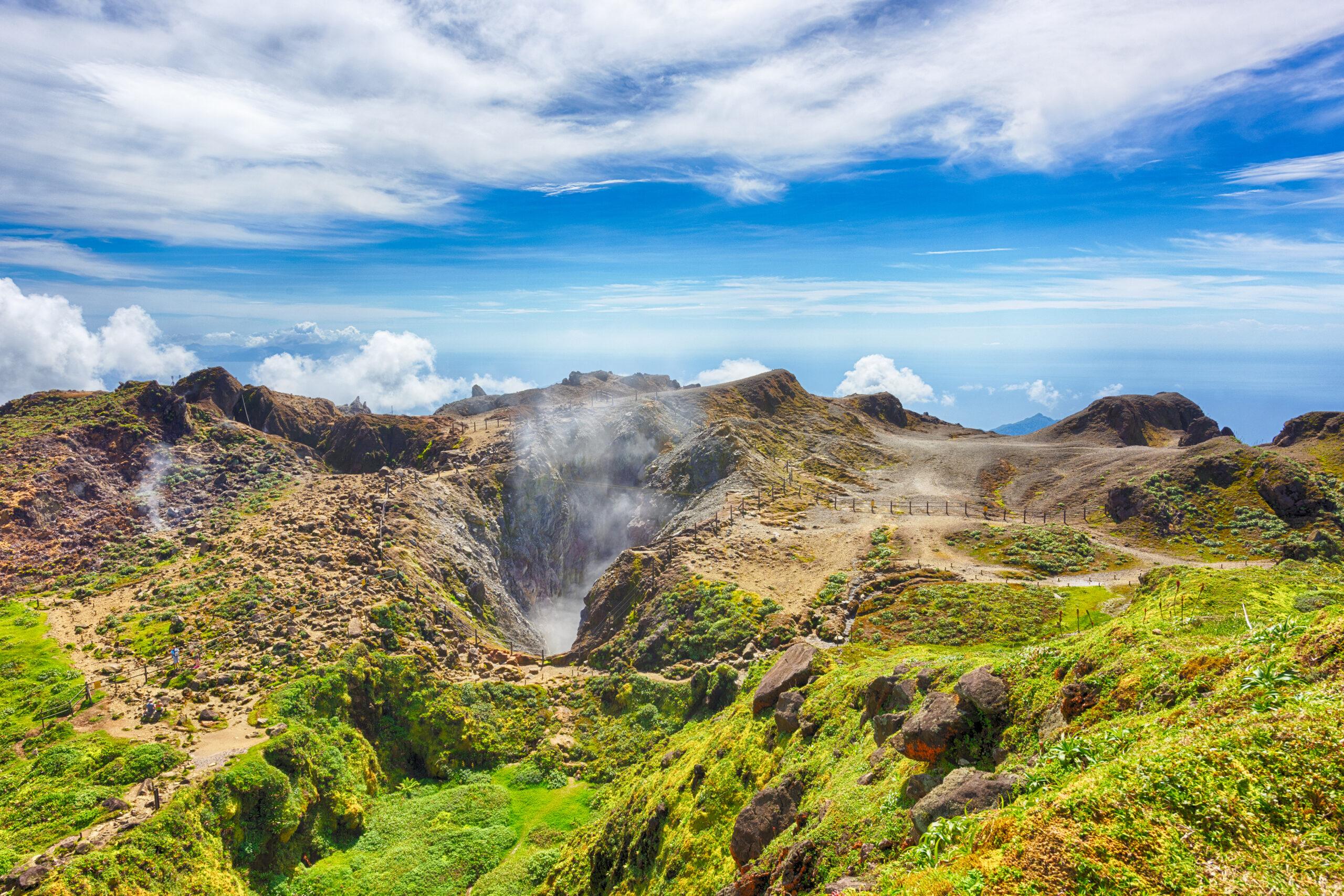 Steam rises from the crater of La Soufrière volcano on Guadeloupe./Shutterstock