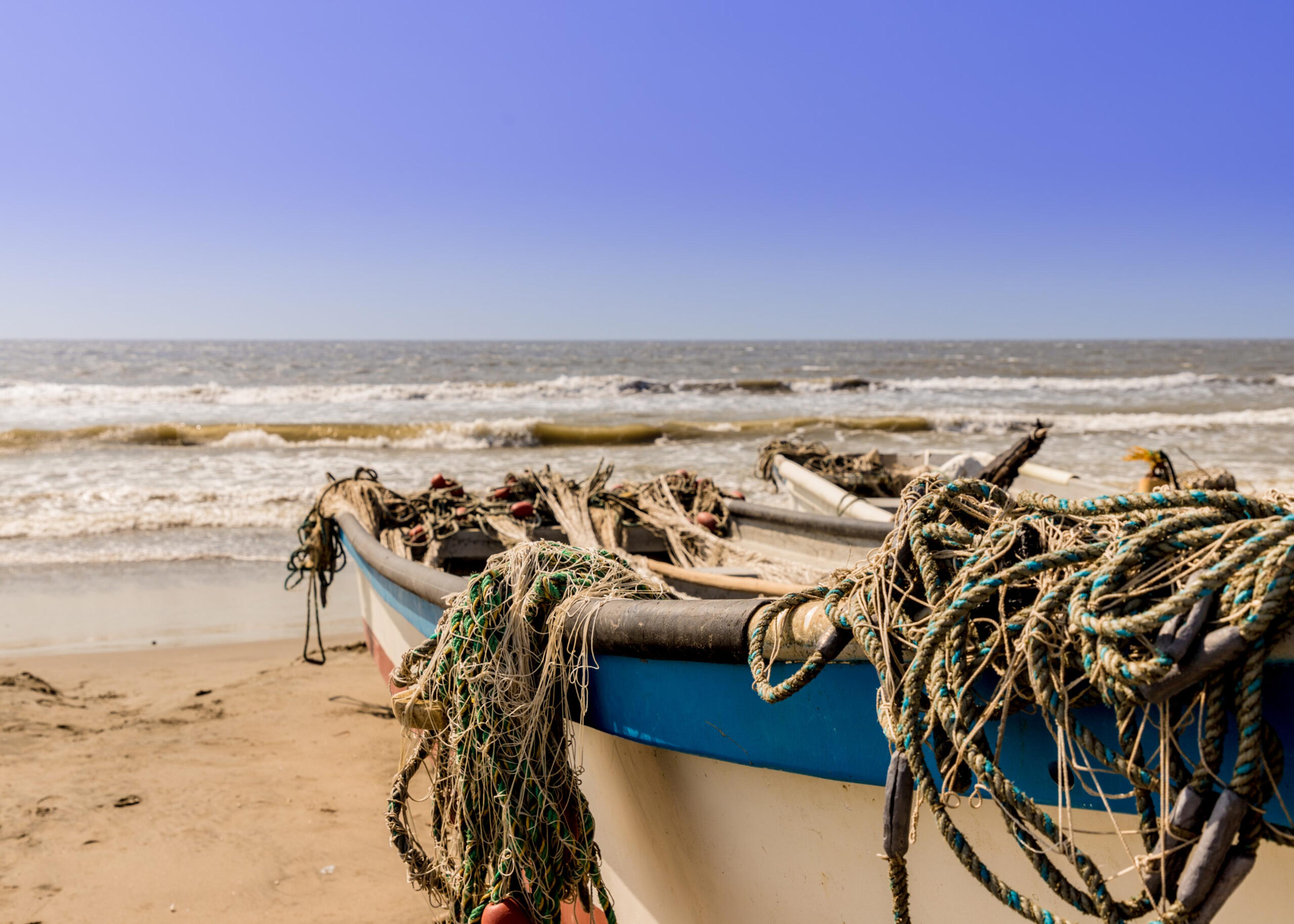 Boats on the beach in La Boquilla Colombia./Getty Images
