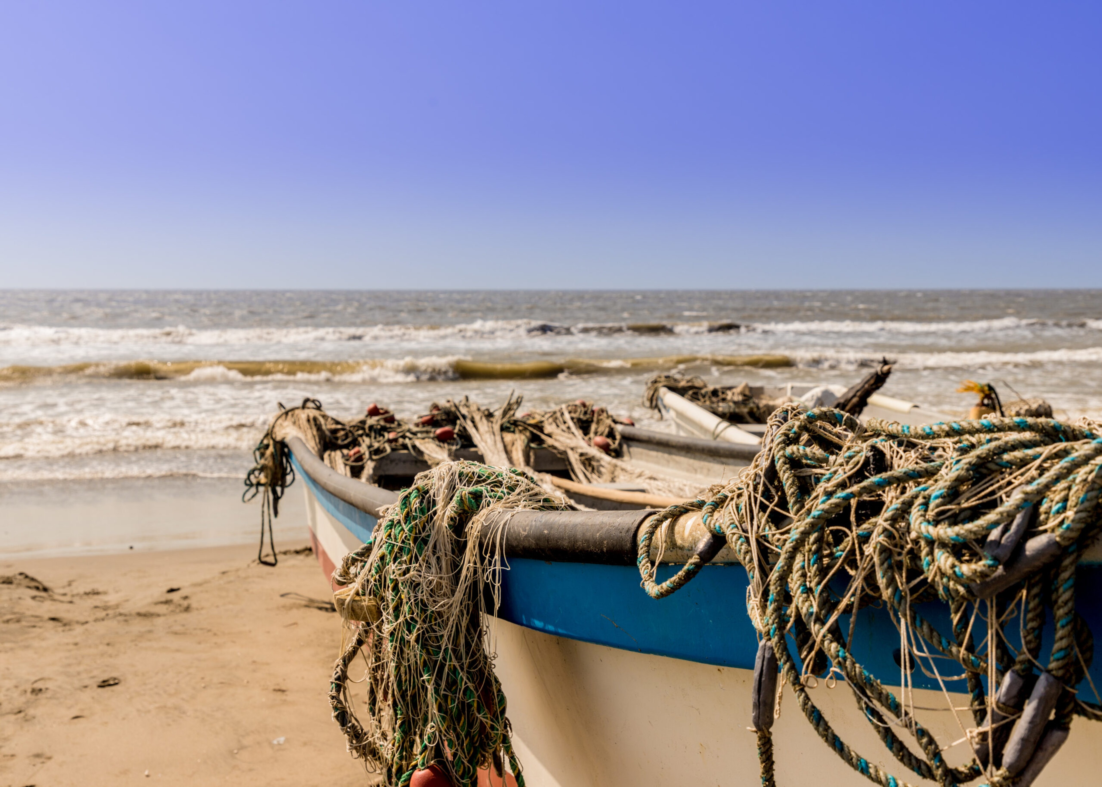 Boats on the beach in La Boquilla Colombia./Getty Images