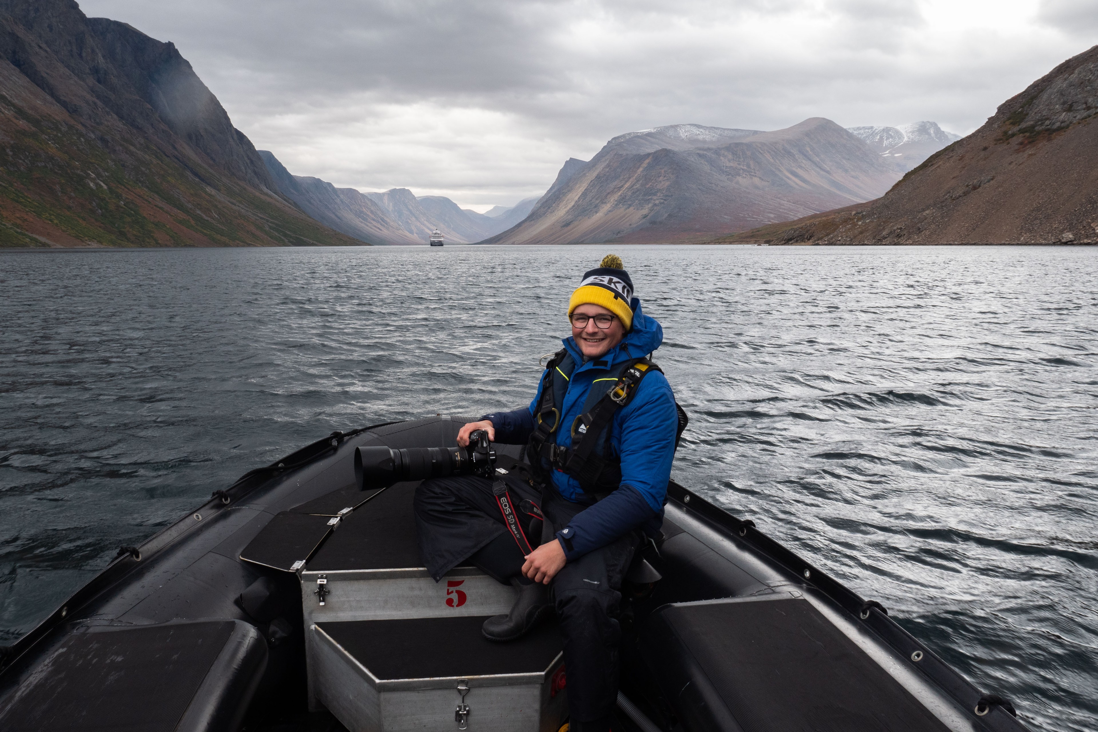 Expedition filmmaker Denis Elterman at work in one of Silversea's Zodiacs