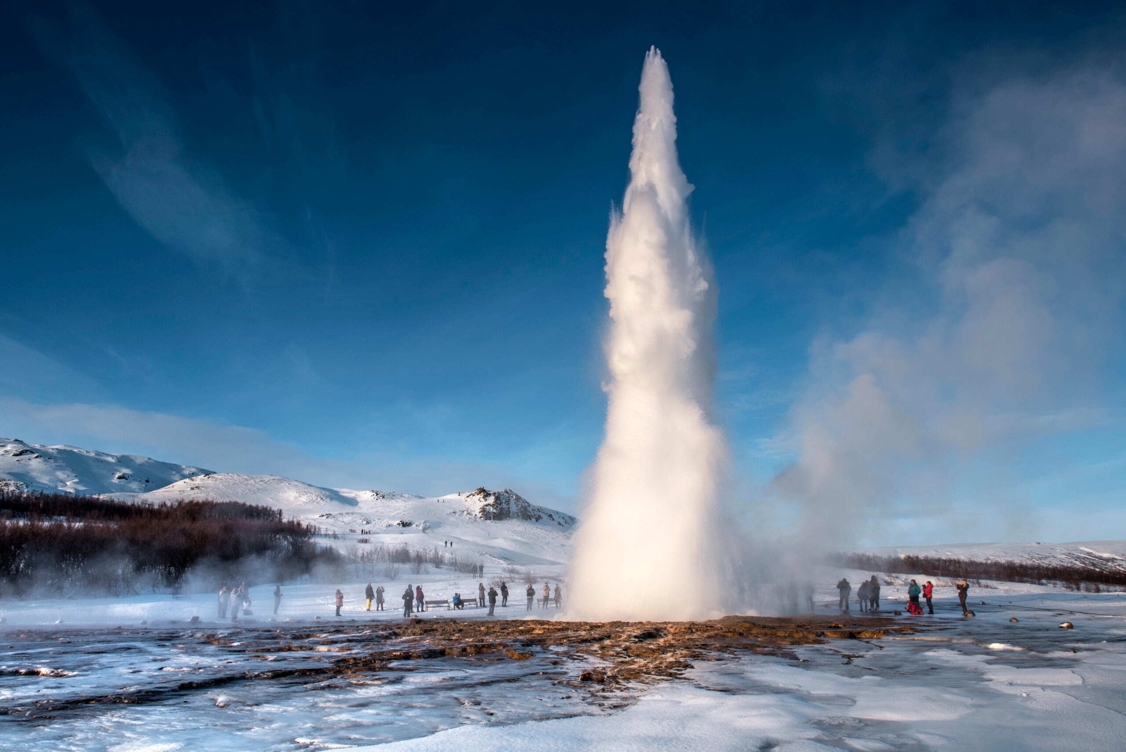 The erupting Great Geysir in the Hauka valley in southwestern Iceland. It has slowed over the years but still shoots the occasional blast of blistering water straight up./Getty Images