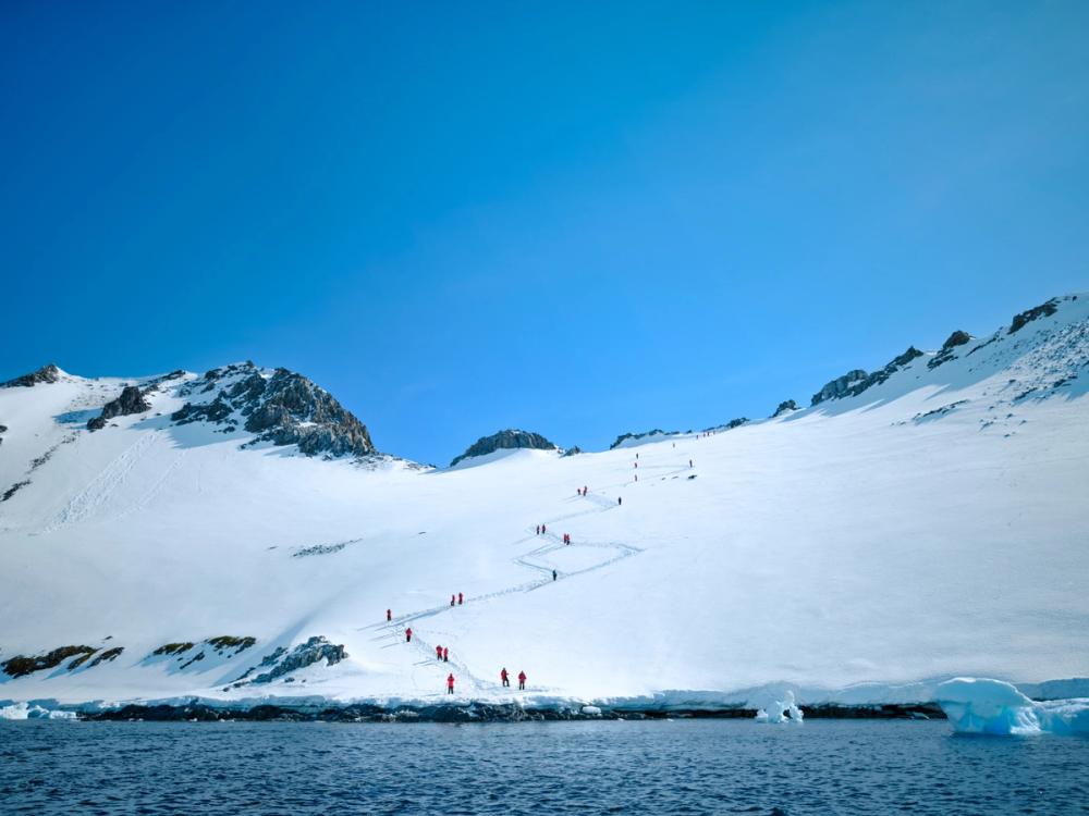 Guests ashore on a snowy Antarctic landing