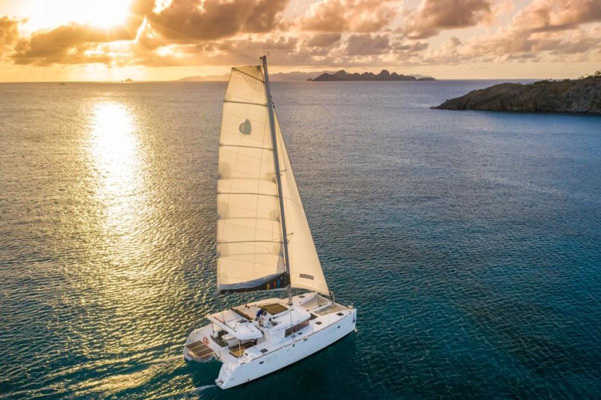 Catamaran Sailing at Sunset