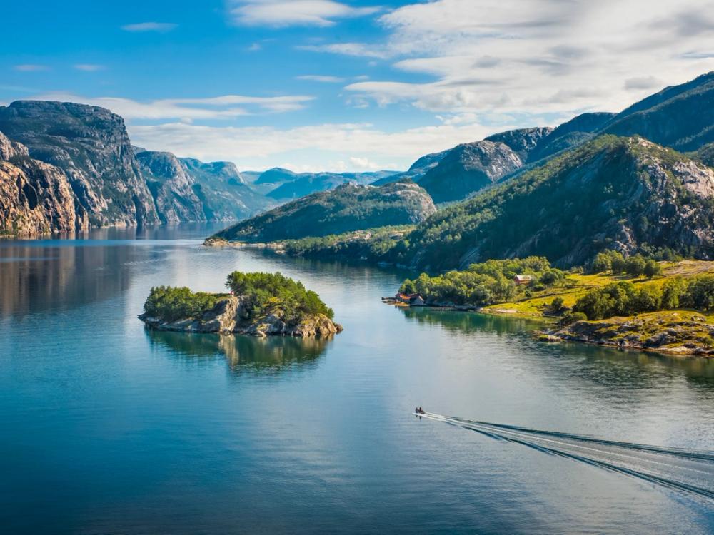 A Norwegian fjord with a small wooded island