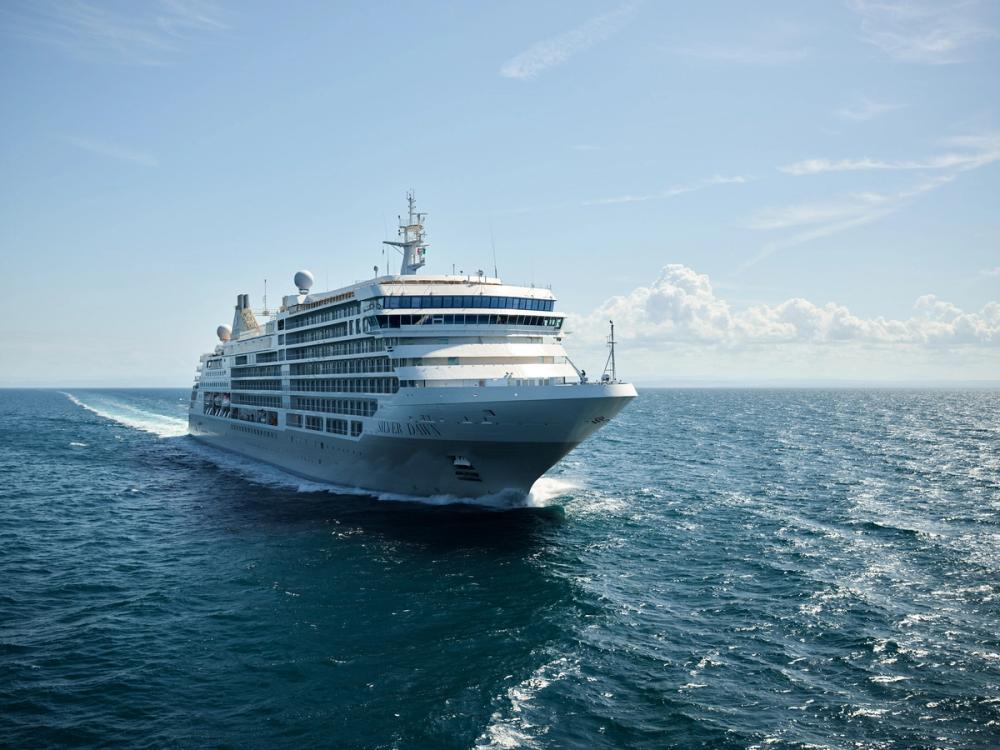 A Silversea ship at sea under a clear blue sky