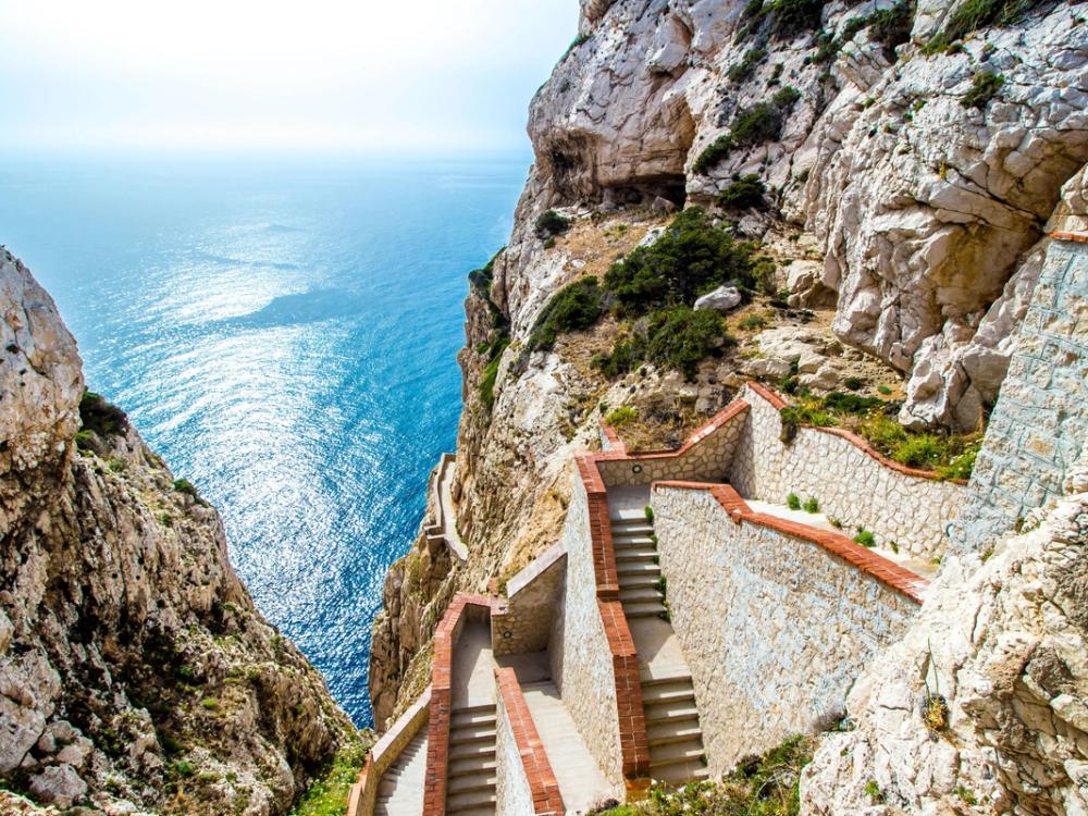 Cliffside steps above the clear Mediterranean