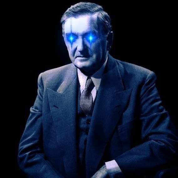Une photo de Maurice Duplessis, dont les yeux tirent des lasers bleus.