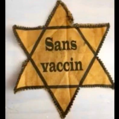 Une photo d'une étoile de Jude, avec les mots « Sans vaccin » (français pour aucun vaccin) en son centre.