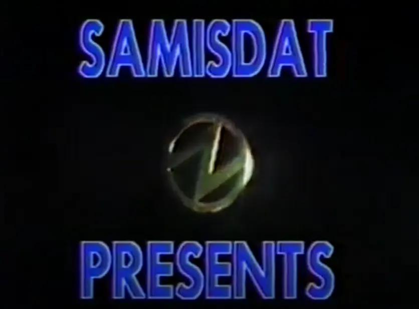 "SAMISDAT PRESENTS" With a lightnight bolt inside a circle in the center of the text.