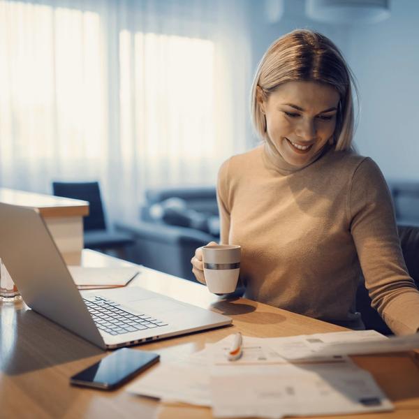 A woman sitting by the computer, trying to get her finances in order. picture.