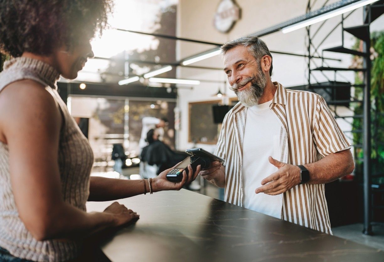 Man paying with credit card on mobile.