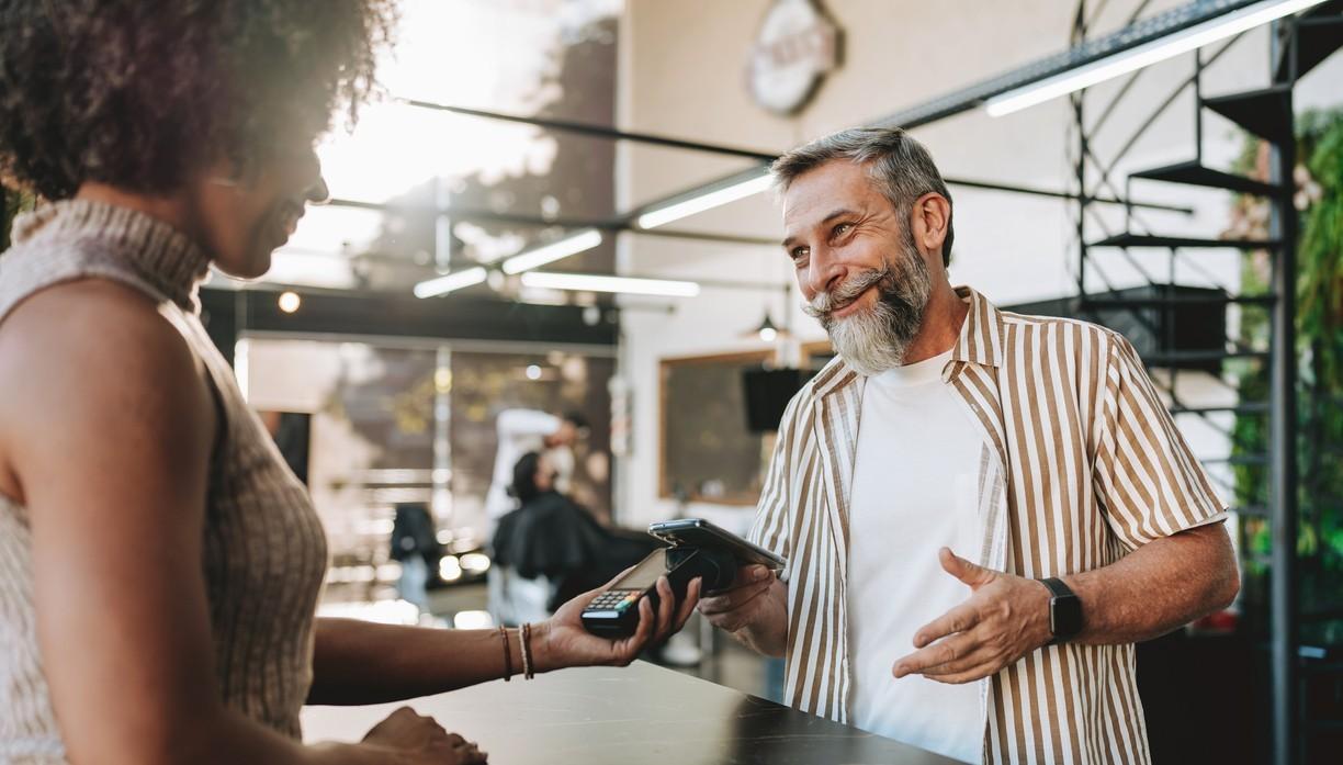 Man paying with credit card on mobile.