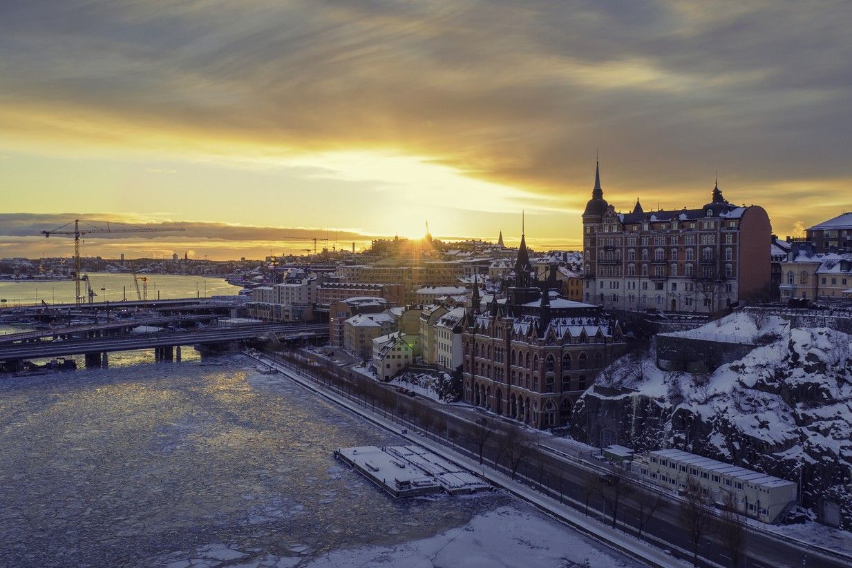View of the sun rising on a winter morning by Slussen and Söder Mälarstrand in Stockholm. picture.