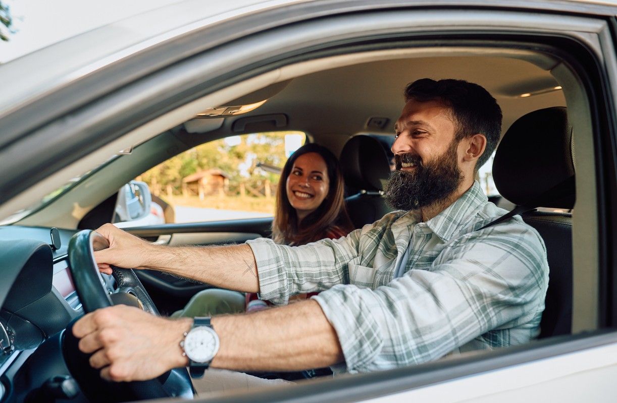 Man and woman driving in a car. The weather is nice. picture.