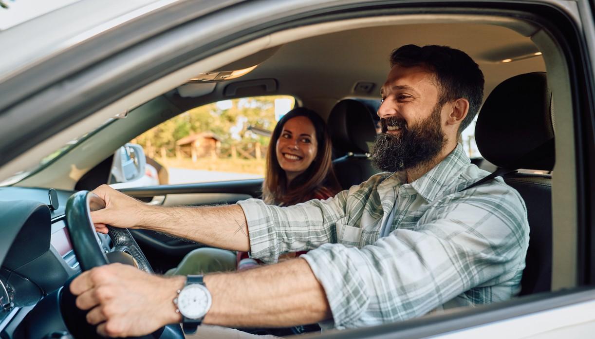 Man and woman driving in a car. The weather is nice. picture.