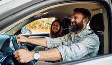 Man and woman driving in a car. The weather is nice. picture.
