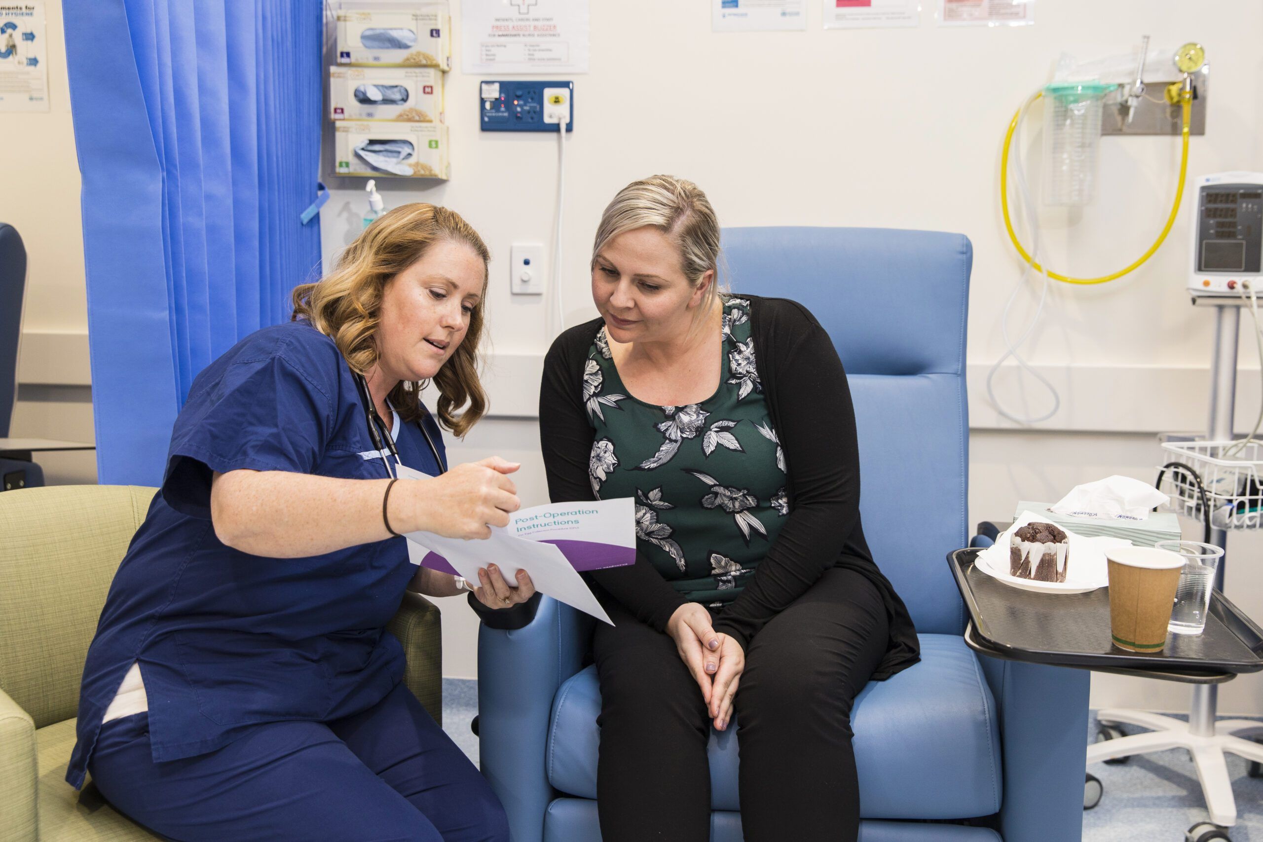 Two Health Care Professionals with patient