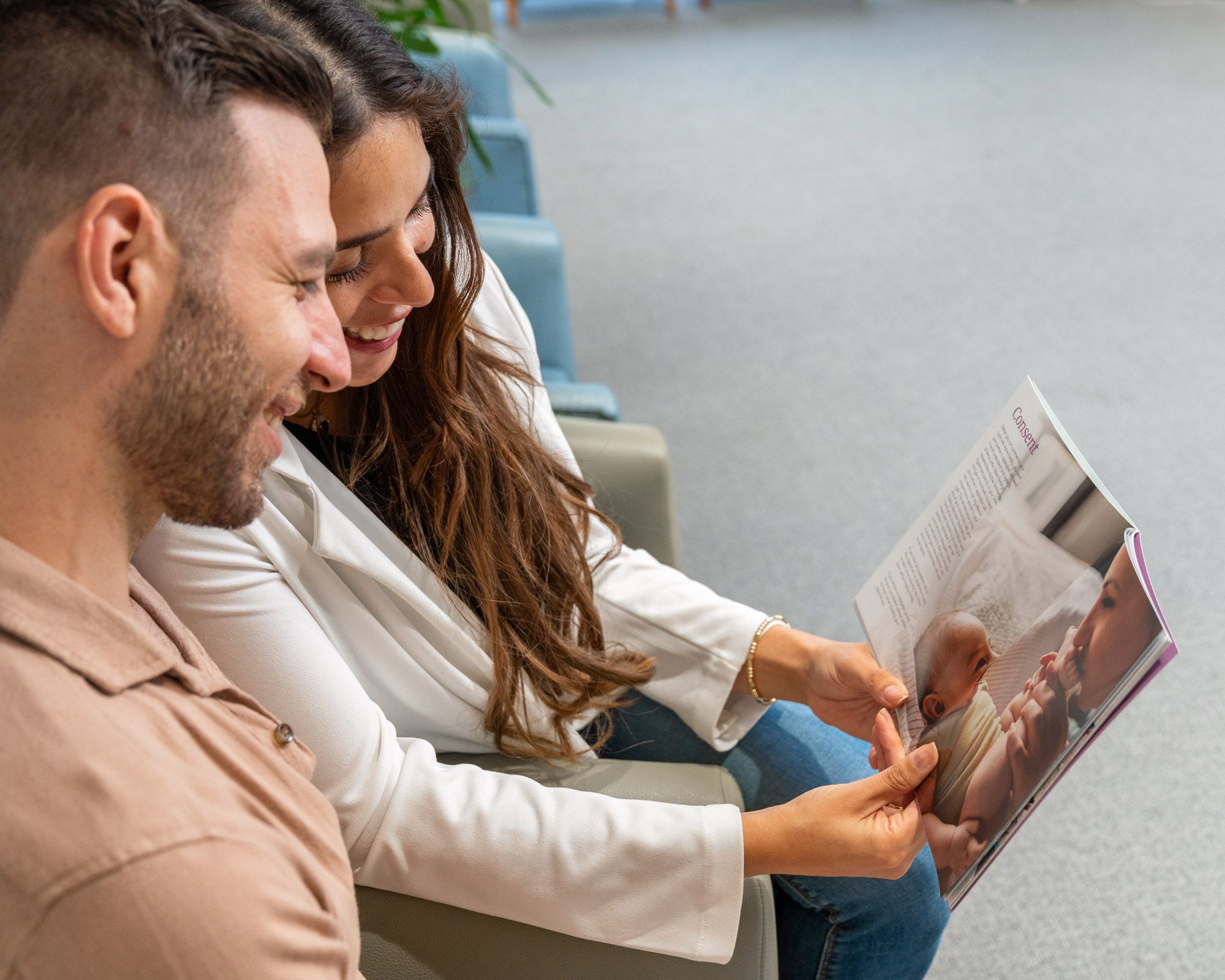 Man and woman reading brochure
