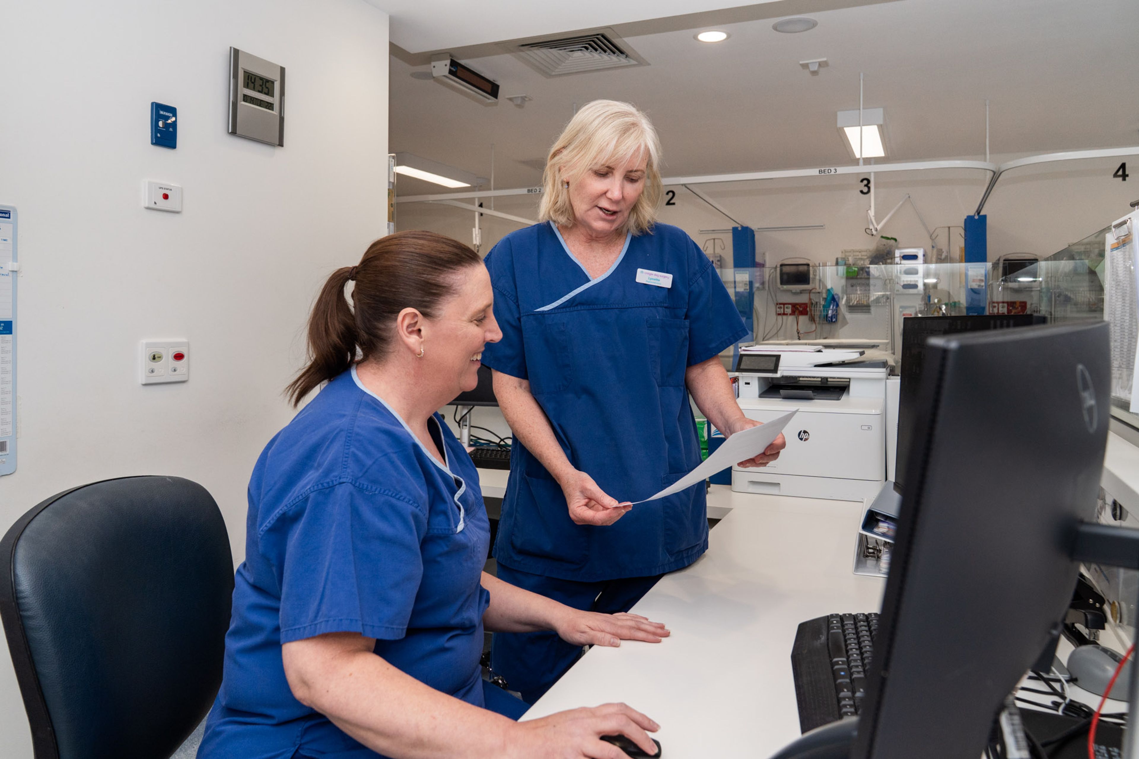 Two women showing an ultrasound image