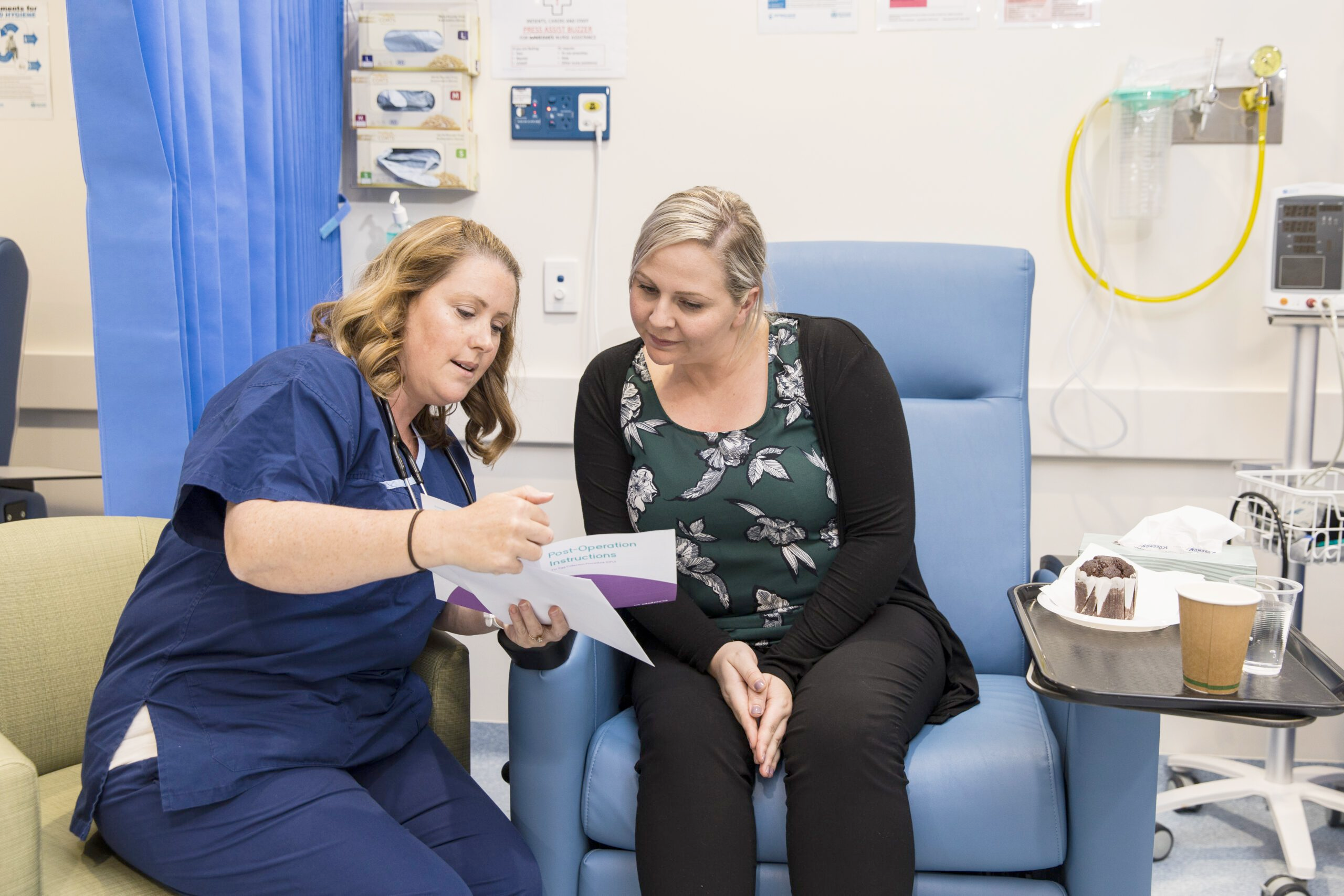 Health Care Professional showing a patient a brochure