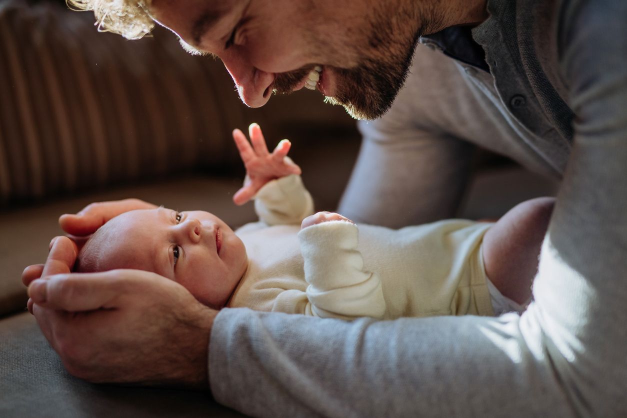 A parent holds their newborn