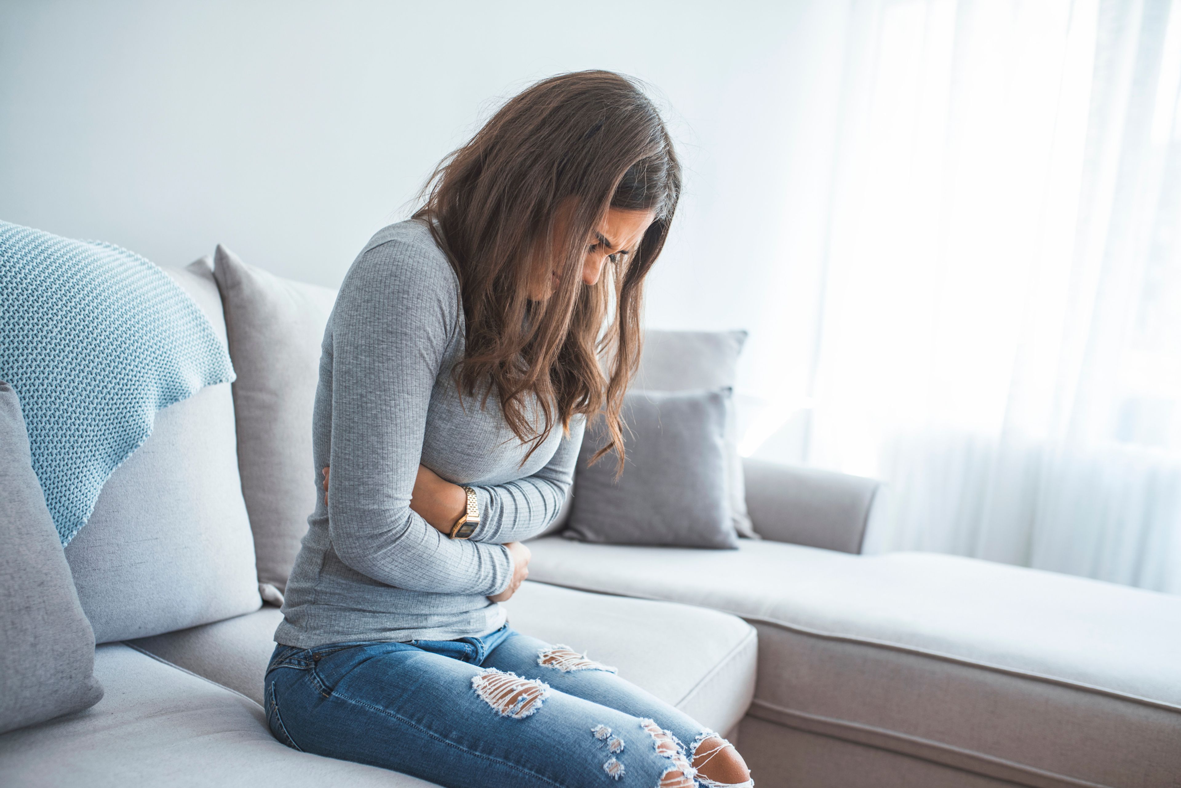 Young woman in pain from endometriosis