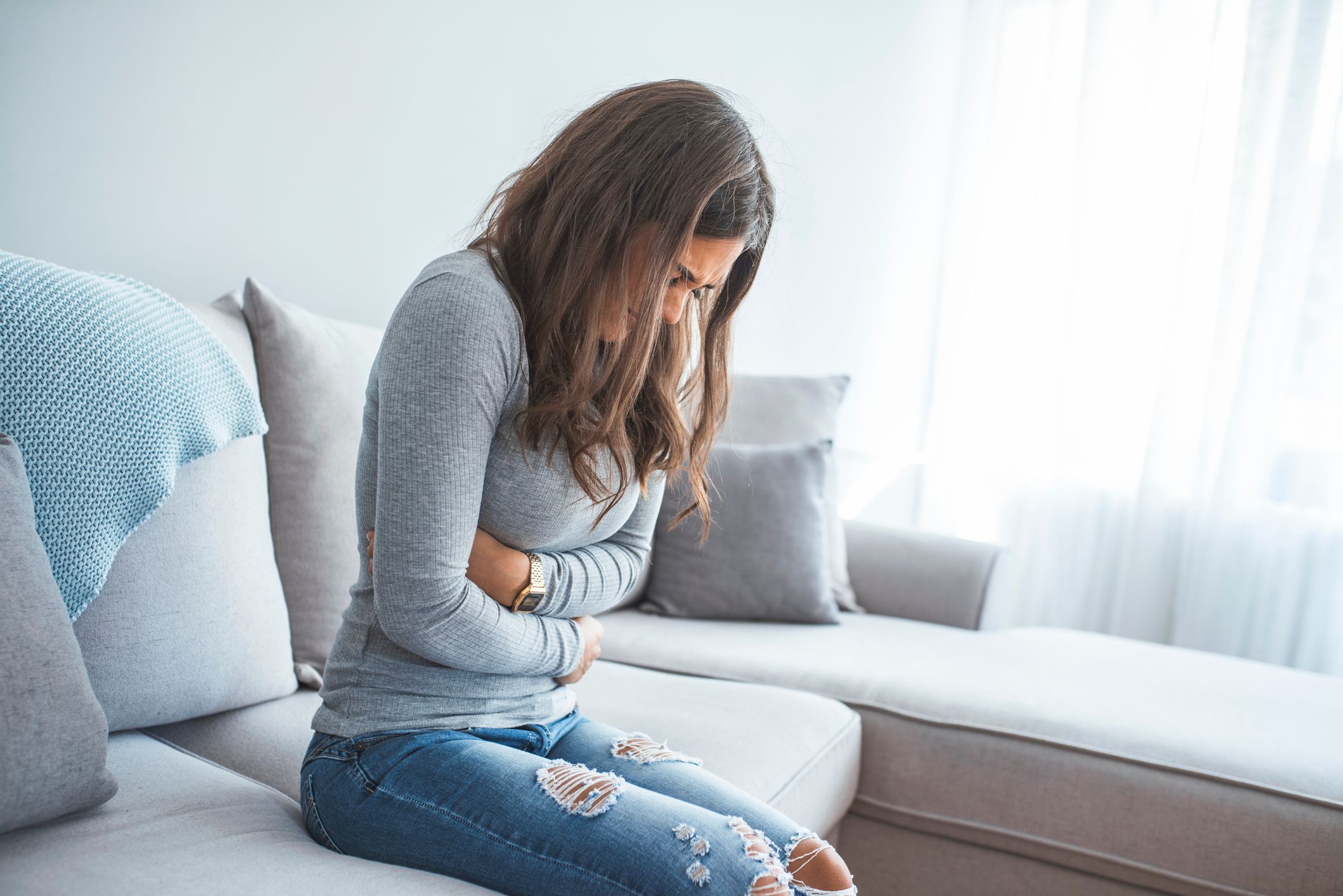 Young woman in pain from endometriosis