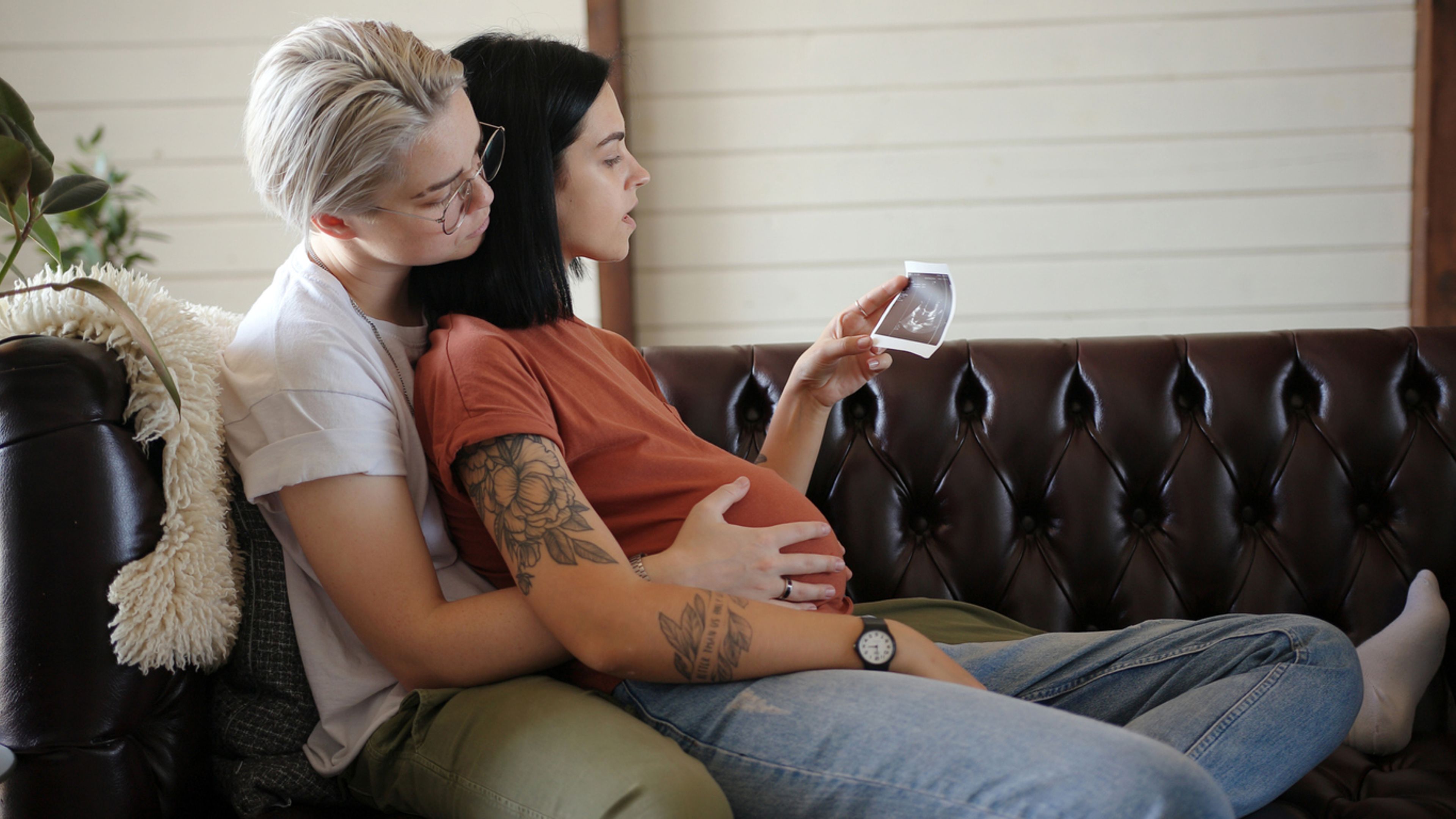 Lesbian couple celebrating pregnancy