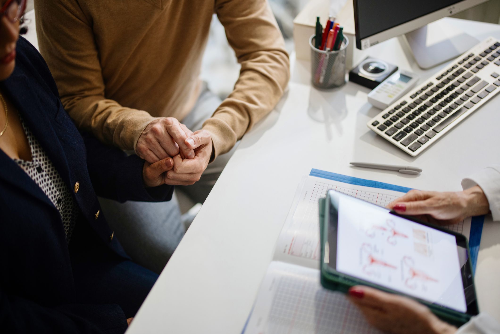 Doctor consulting patients