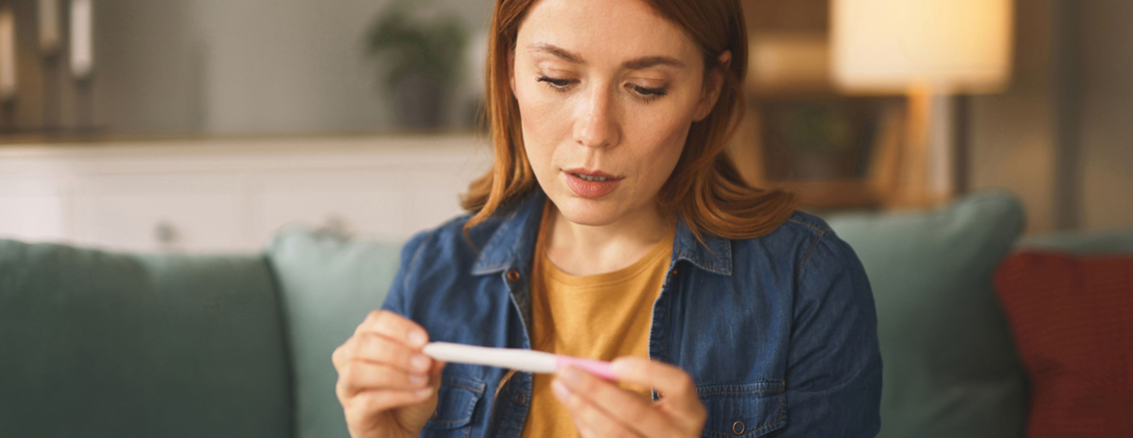 Woman checking a pregnancy test