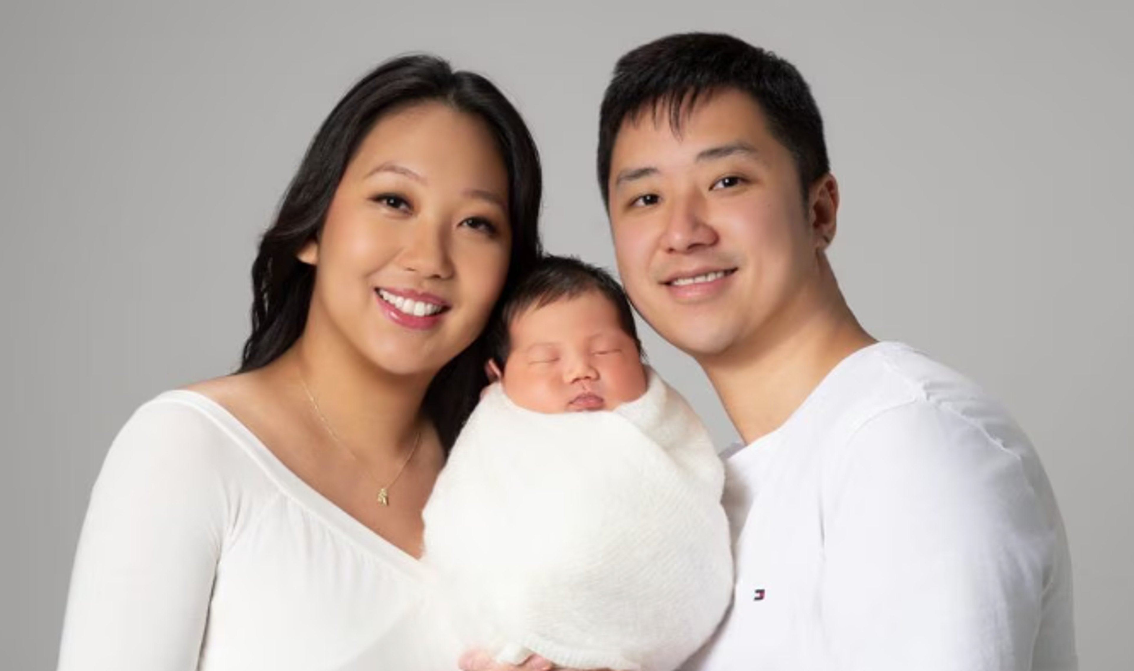 Melissa and Dat with their new born child.