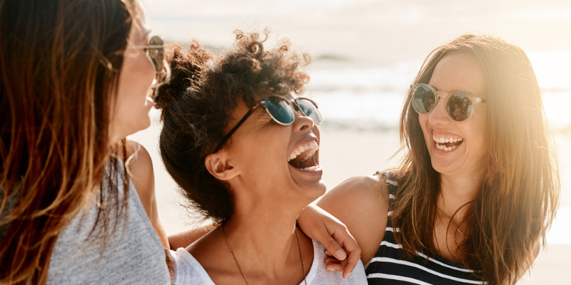 Three women laughing