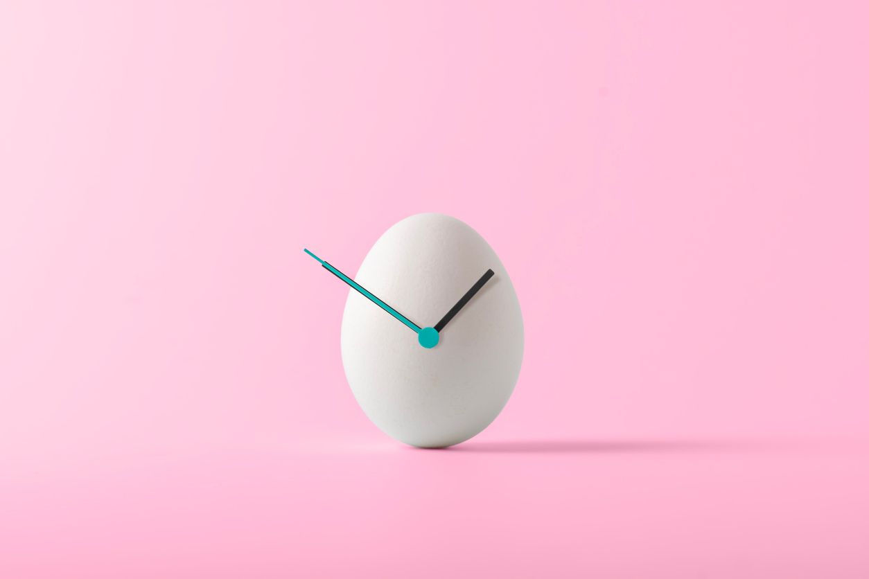 White egg with a clock overlaid.