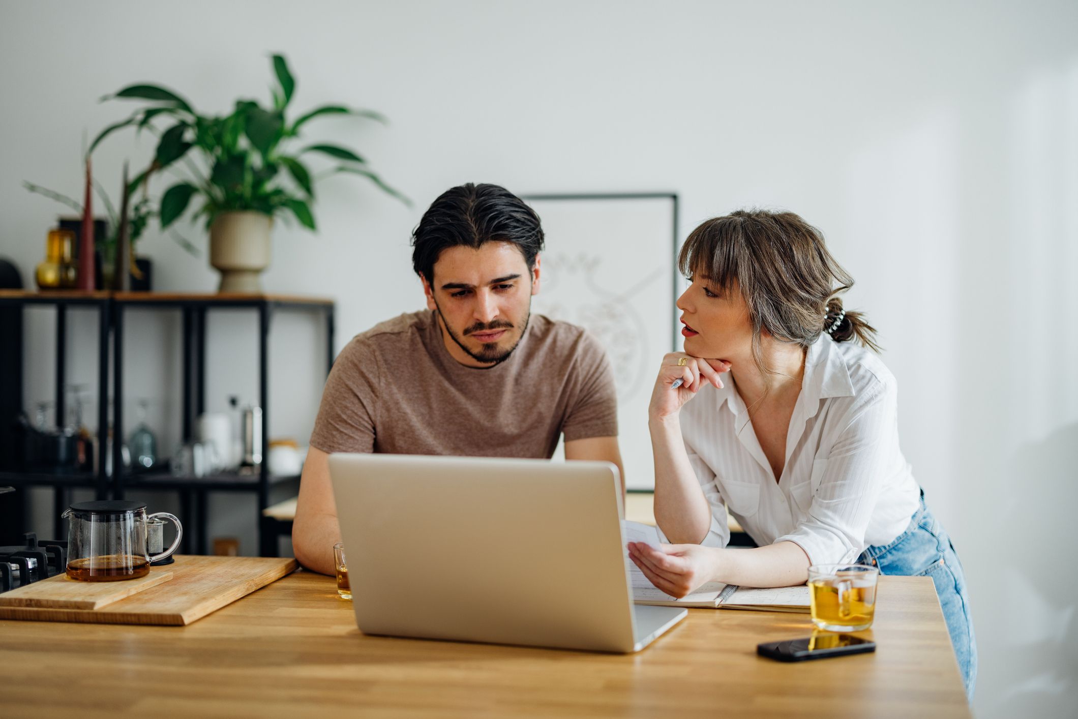 Couple researching on computer