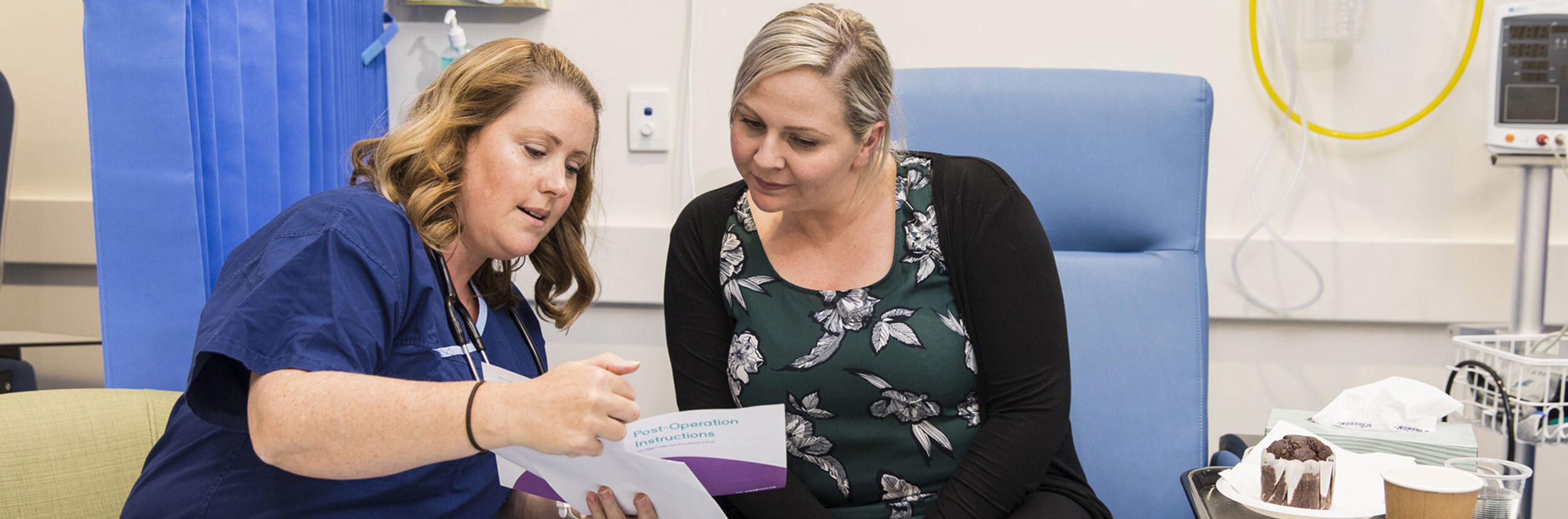 Nurse showing a patient a brochure