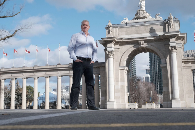 Don Boyle, CEO of Exhibition Place, stands in front of the Princes’ Gates at Exhibition Place, Toronto.