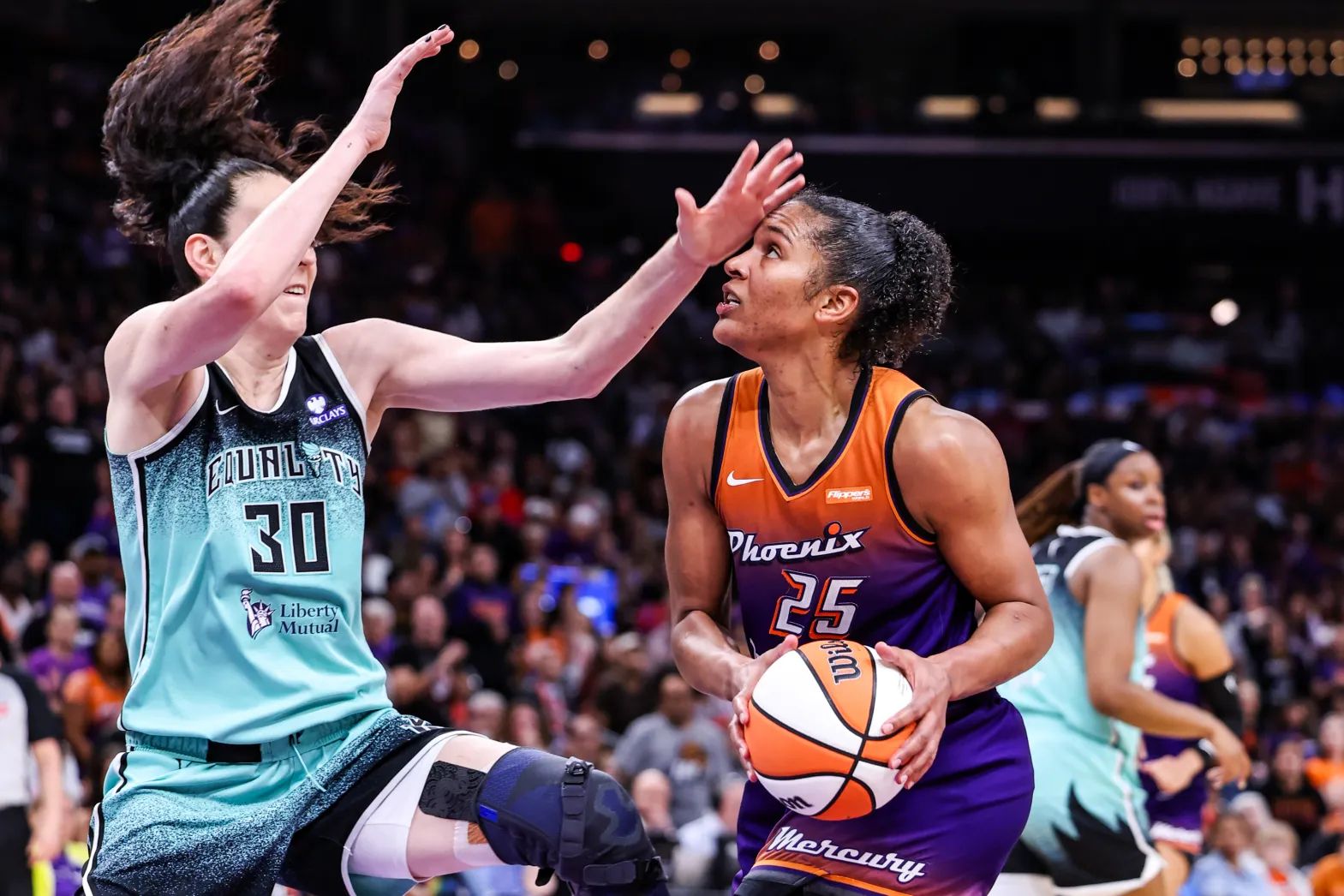 The NY Liberty’s Breanna Stewart defends Phoenix Mercury star Alyssa Thomas in a 2025 regular-season game.
