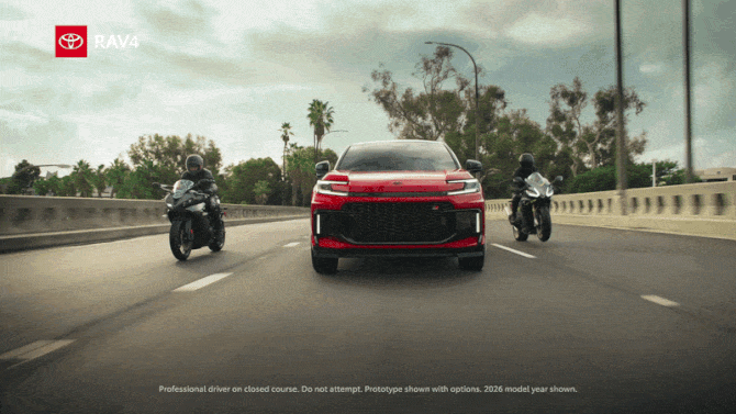 A red RAV4 drives on a bridge trailed by two motorcycles. Text reads "Rapid Acceleration Vehicle 4FUN"