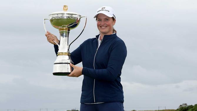 Lottie Woad of England poses with the trophy following victory of the ISPS HANDA Women's Scottish Open