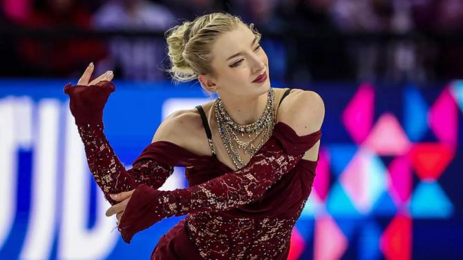 Amber Glenn glides on the ice.