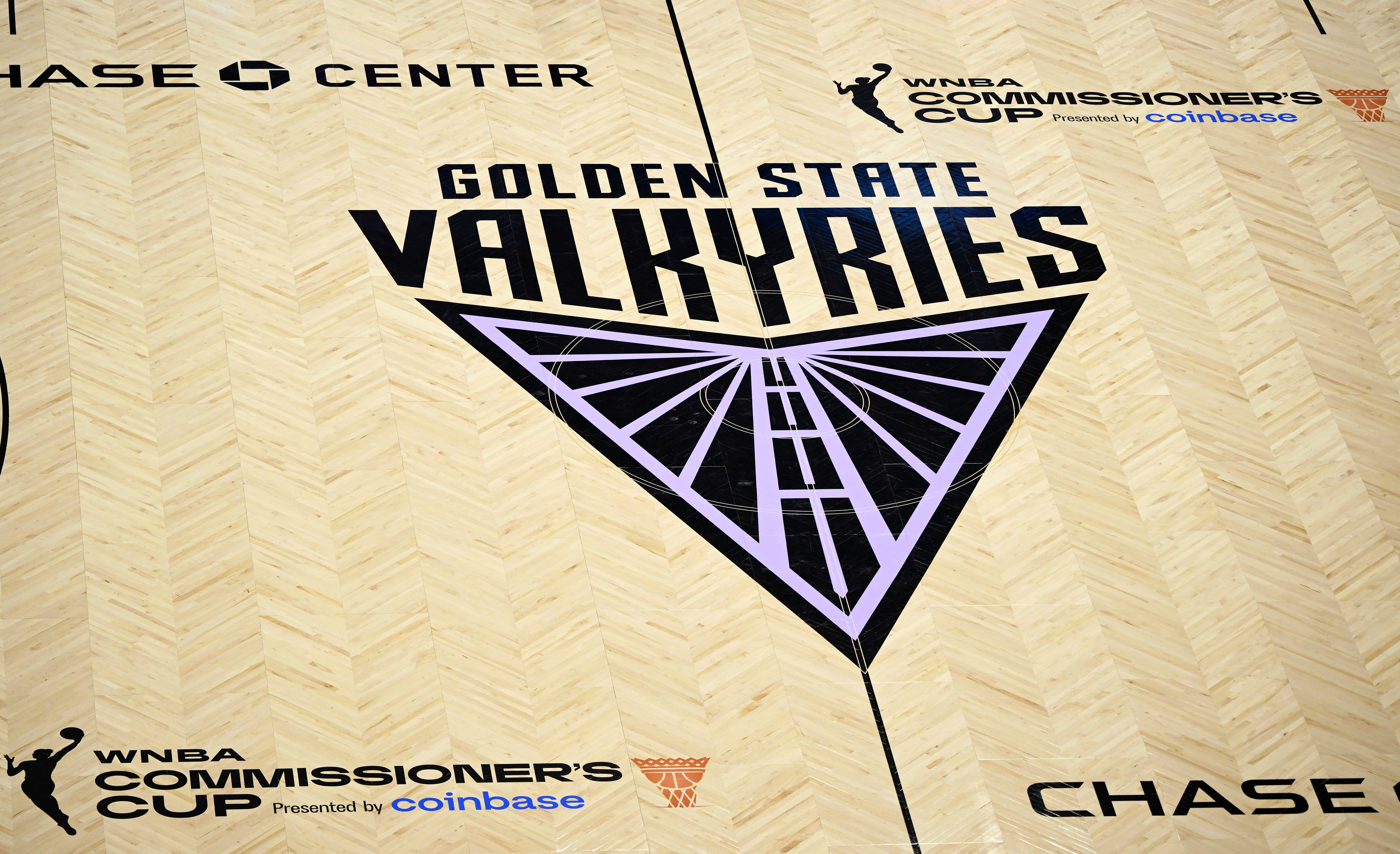 Basketball court featuring the Golden State Valkyries logo for the Commissioner's Cup