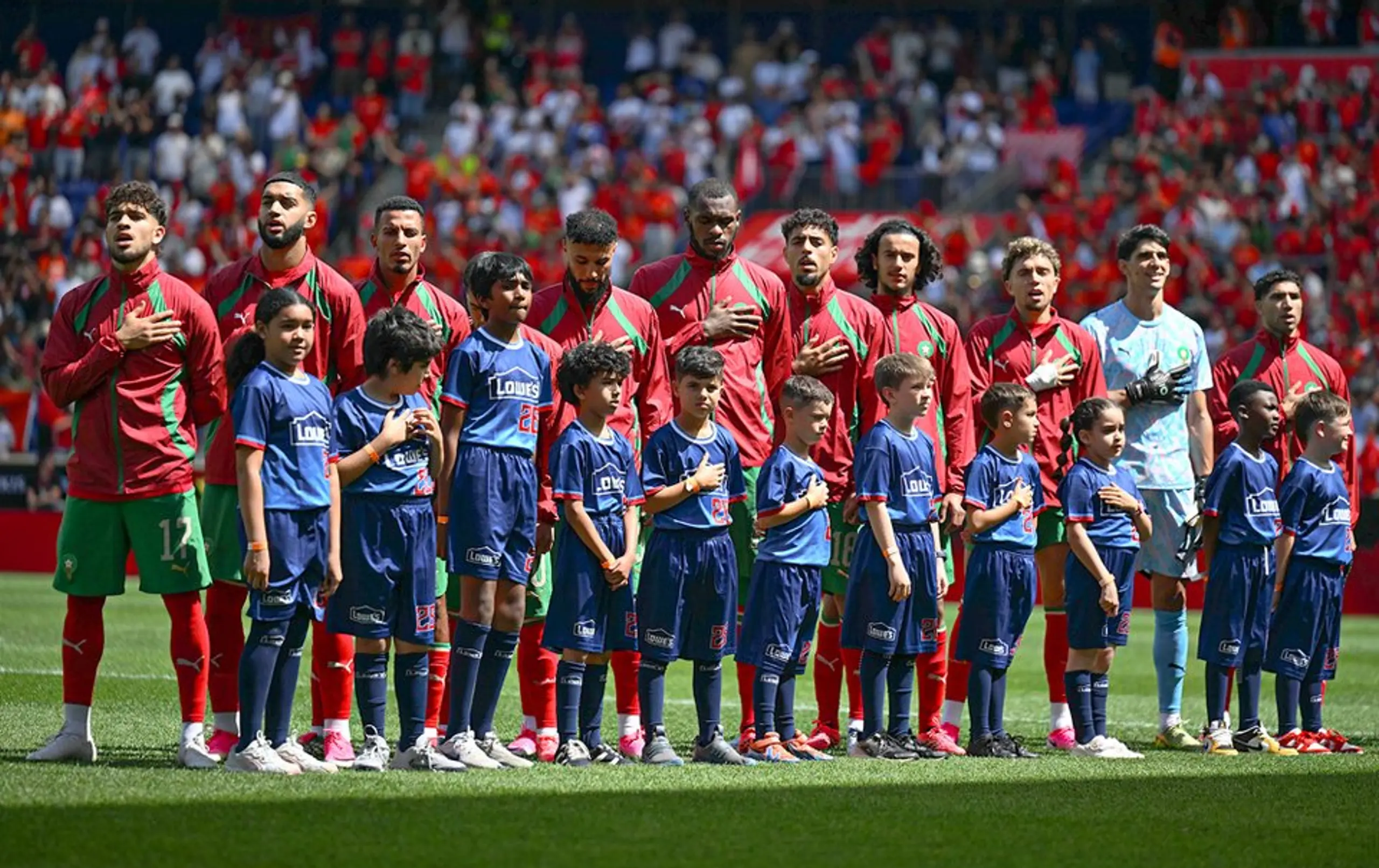 Morroccan players sing their national anthem before a friendly against Norway.